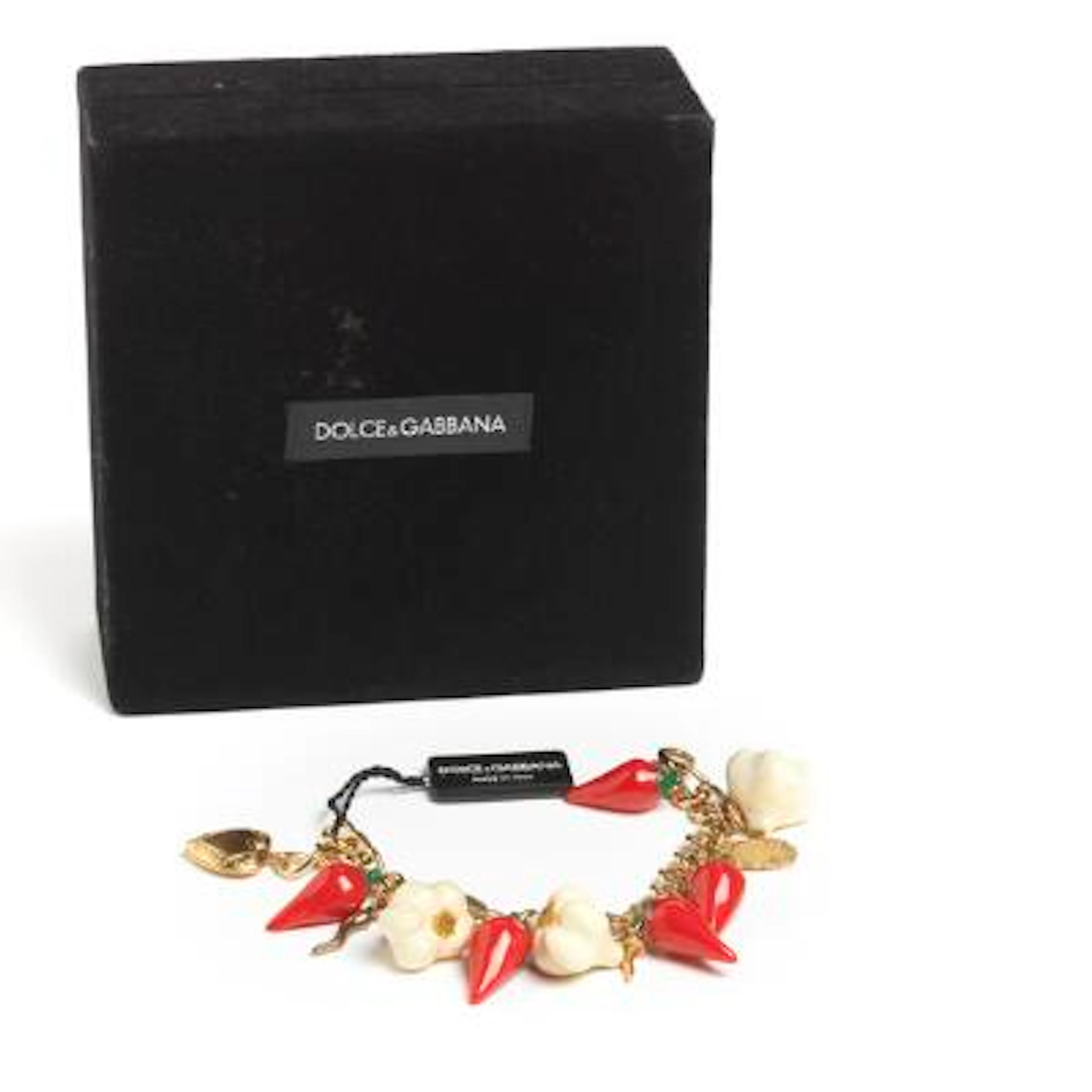 Dolce & Gabbana: A bracelet with numerous charms, mounted in gold