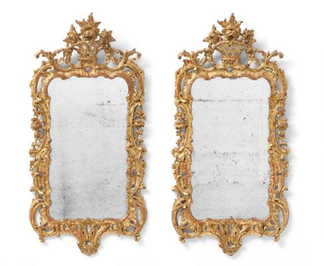 A pair of George III mirrors of gilded wood, pierced frames, each