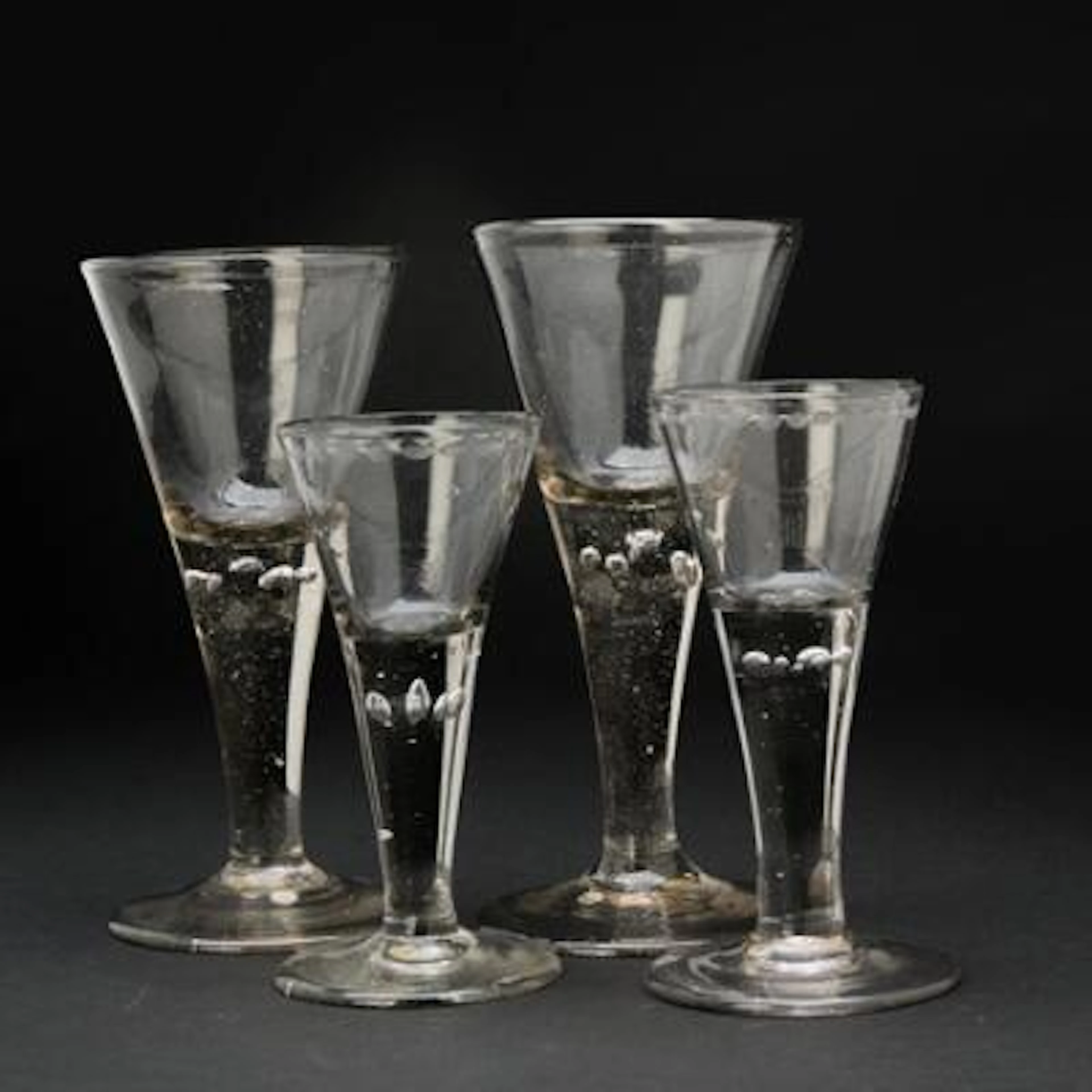 Two pair of trumpet glasses "Perlkelchen” on a massive stem with air-filled