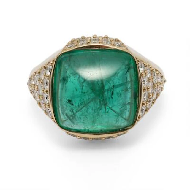 An emerald and diamond ring set with an emerald weighing app. 5.00