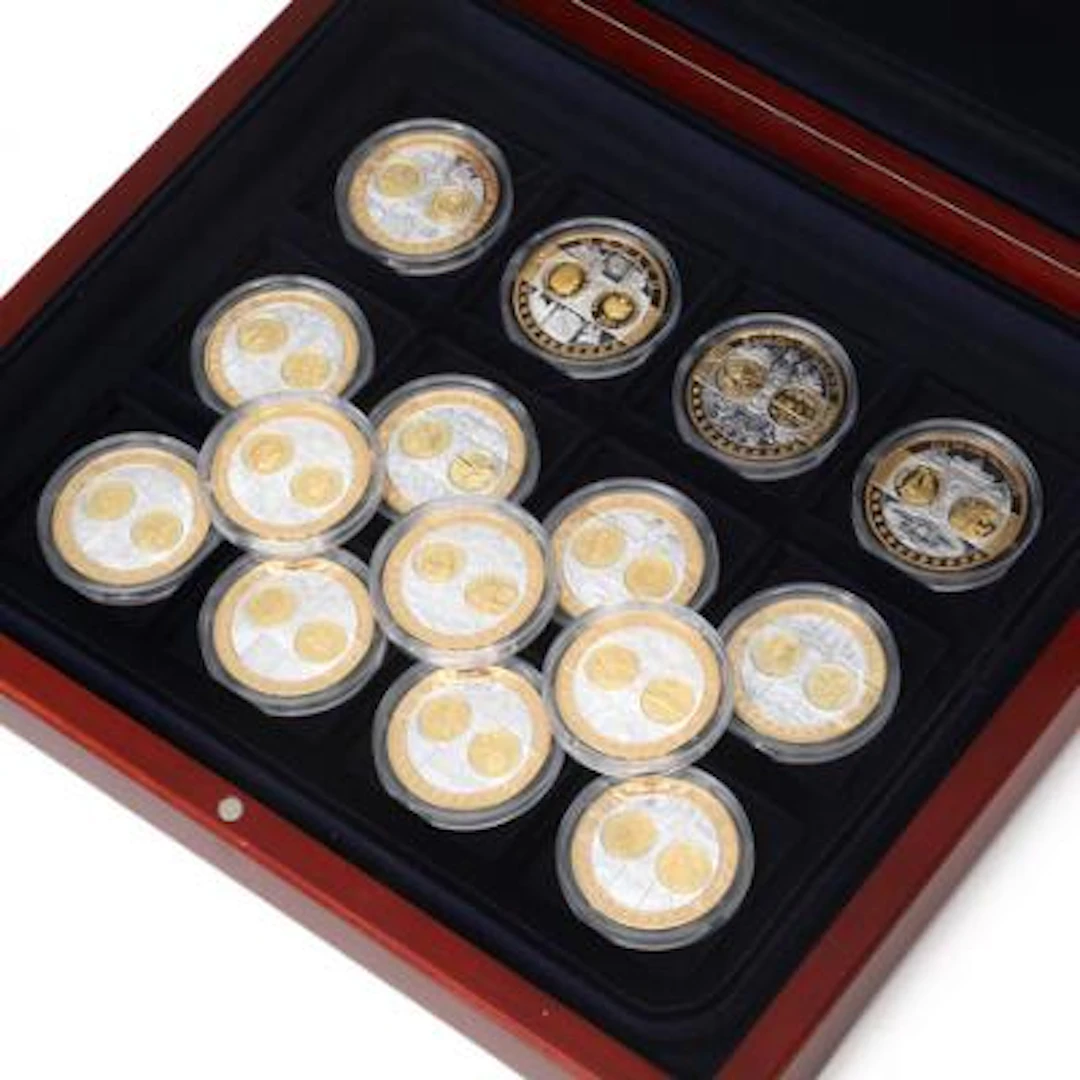 Collection of medals featuring the first Euro-zone coin issues, in