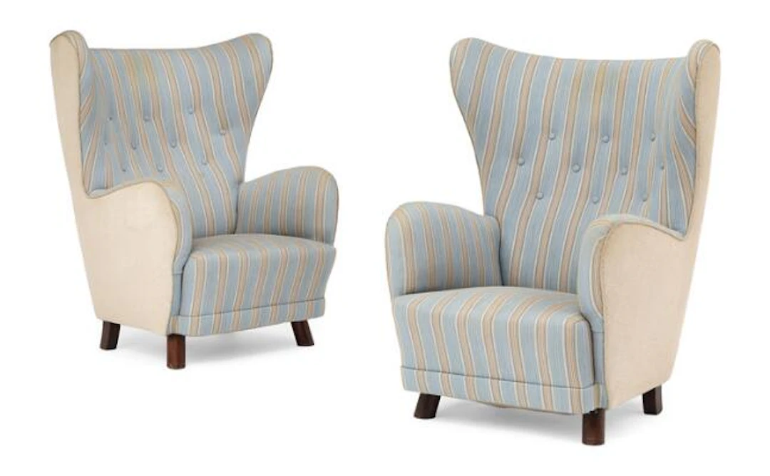 Danish cabinetmaker: A pair of easy chairs with stained beech legs.