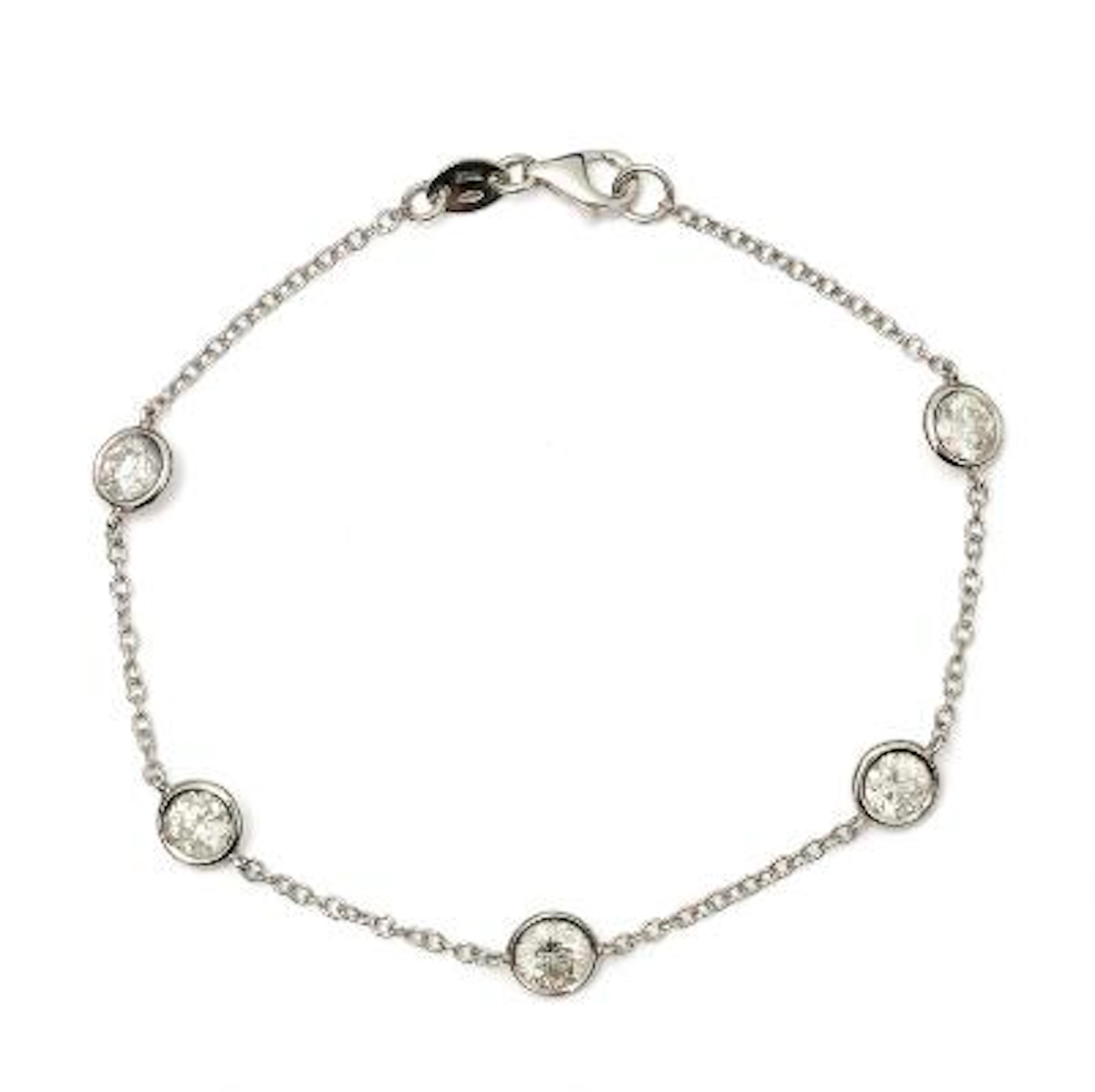 A diamond bracelet set with five diamonds mounted in 18k white gold.