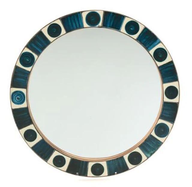Dietlinde Hein: A circular wall mirror, the frame decorated with glazed