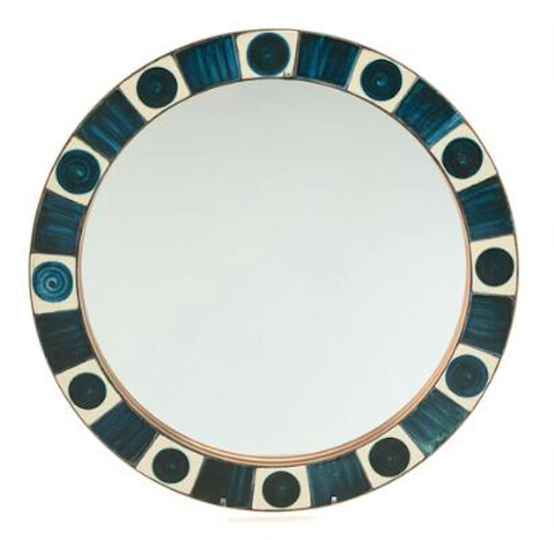 Dietlinde Hein: A circular wall mirror, the frame decorated with glazed