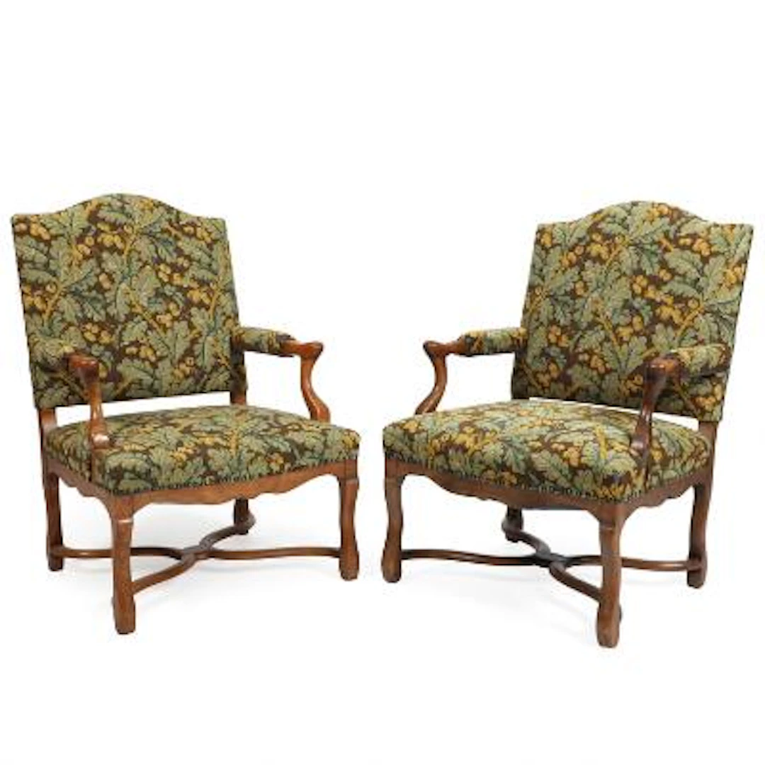 A pair of 20th century oak wood armchairs, upholstered with embroidered