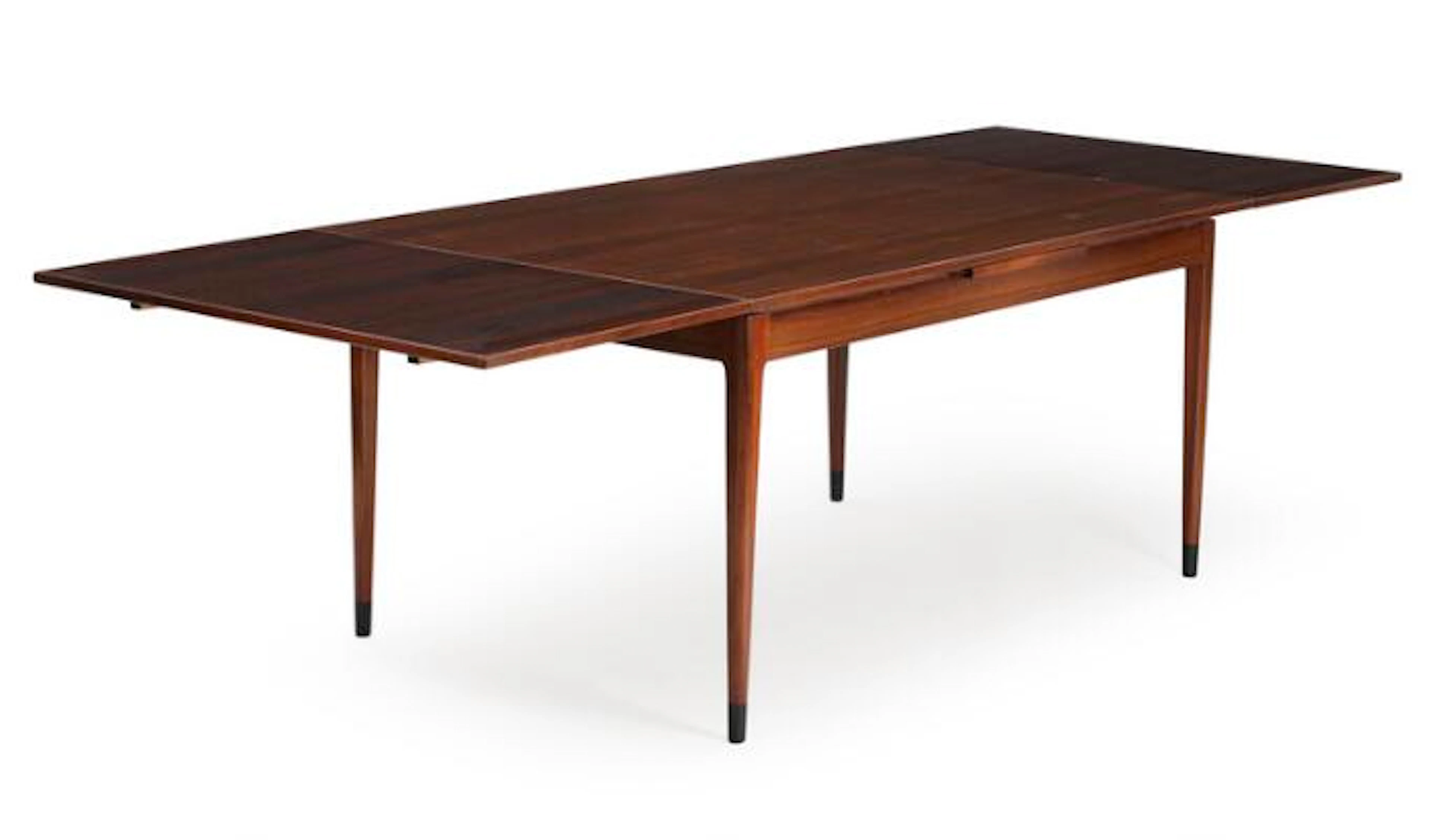Niels O. Møller: A rosewood dining table with extension, dark lacquered