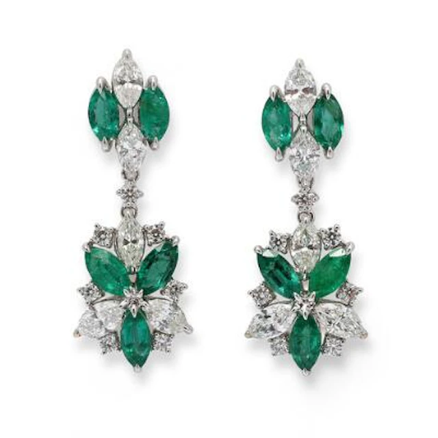 A pair of emerald ear studs set with emeralds and diamonds, mounted