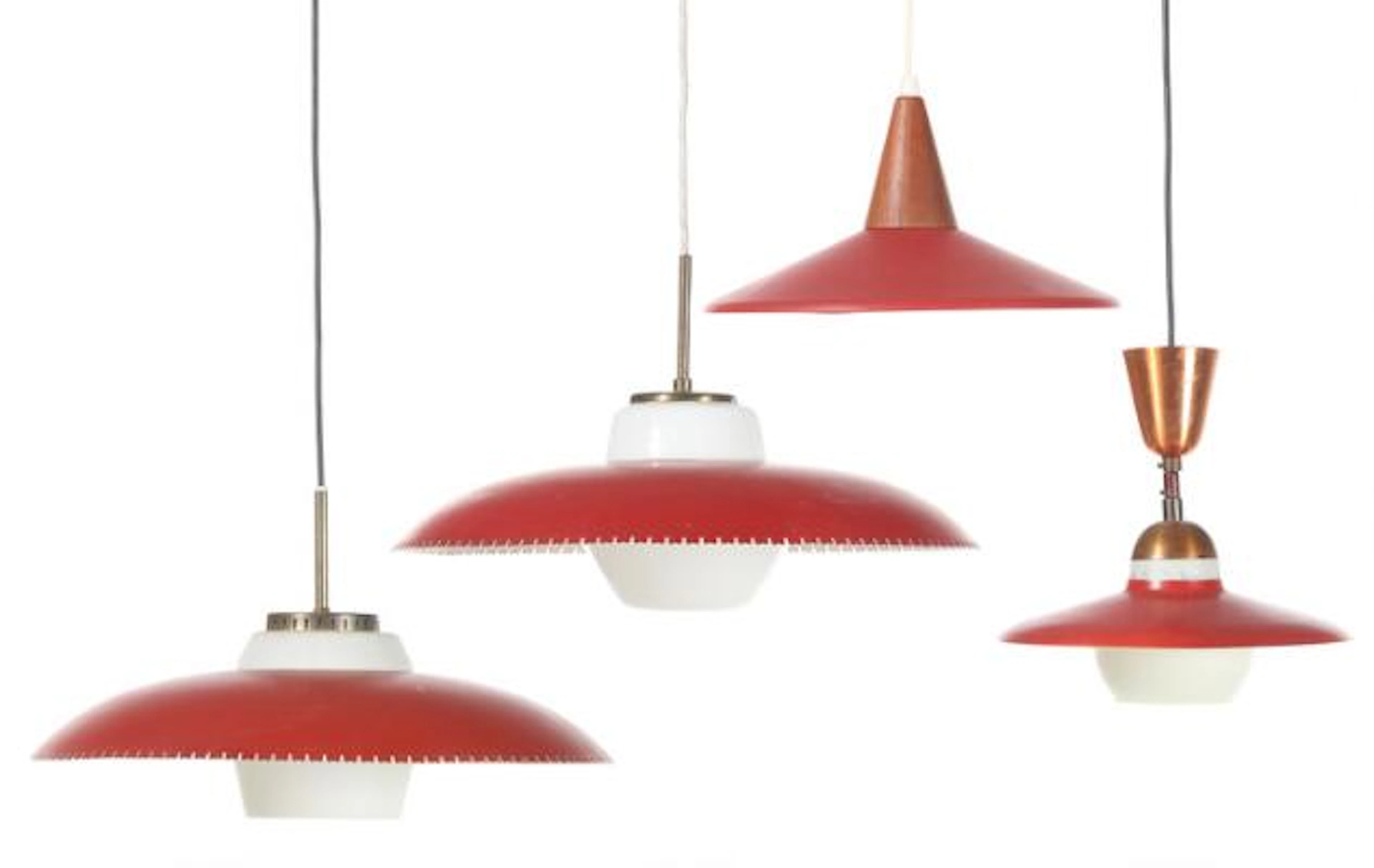 Danish design: Four pendants with red lacquered metal shades, partly