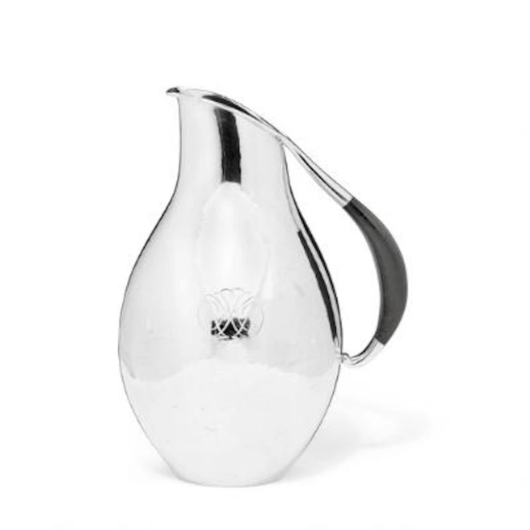 Johan Rohde: A sterling silver pitcher with hammered surface and ebony