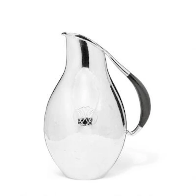 Johan Rohde: A sterling silver pitcher with hammered surface and ebony
