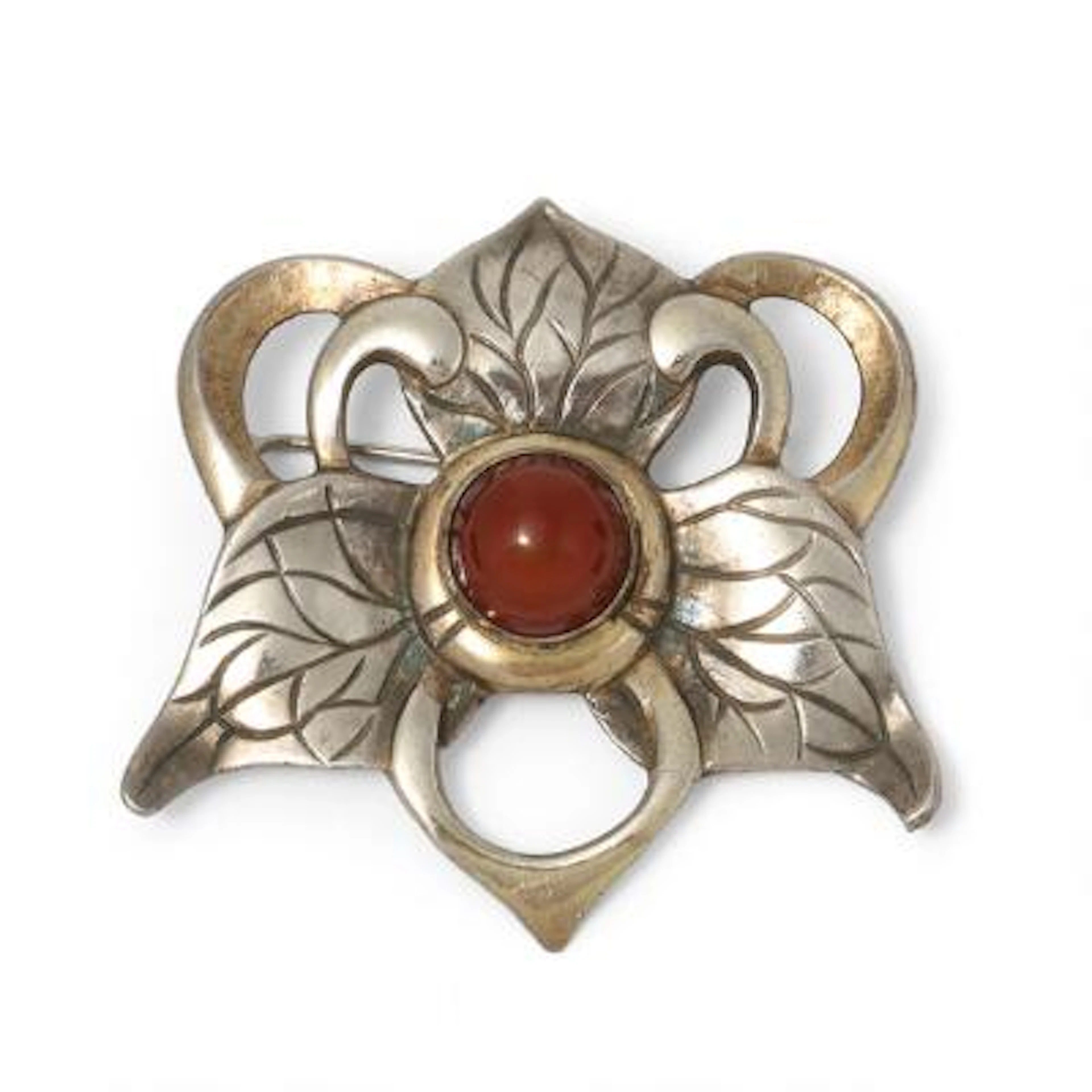 Mogens Ballin: A carnelia brooch set with a cabochon carnelia, mounted