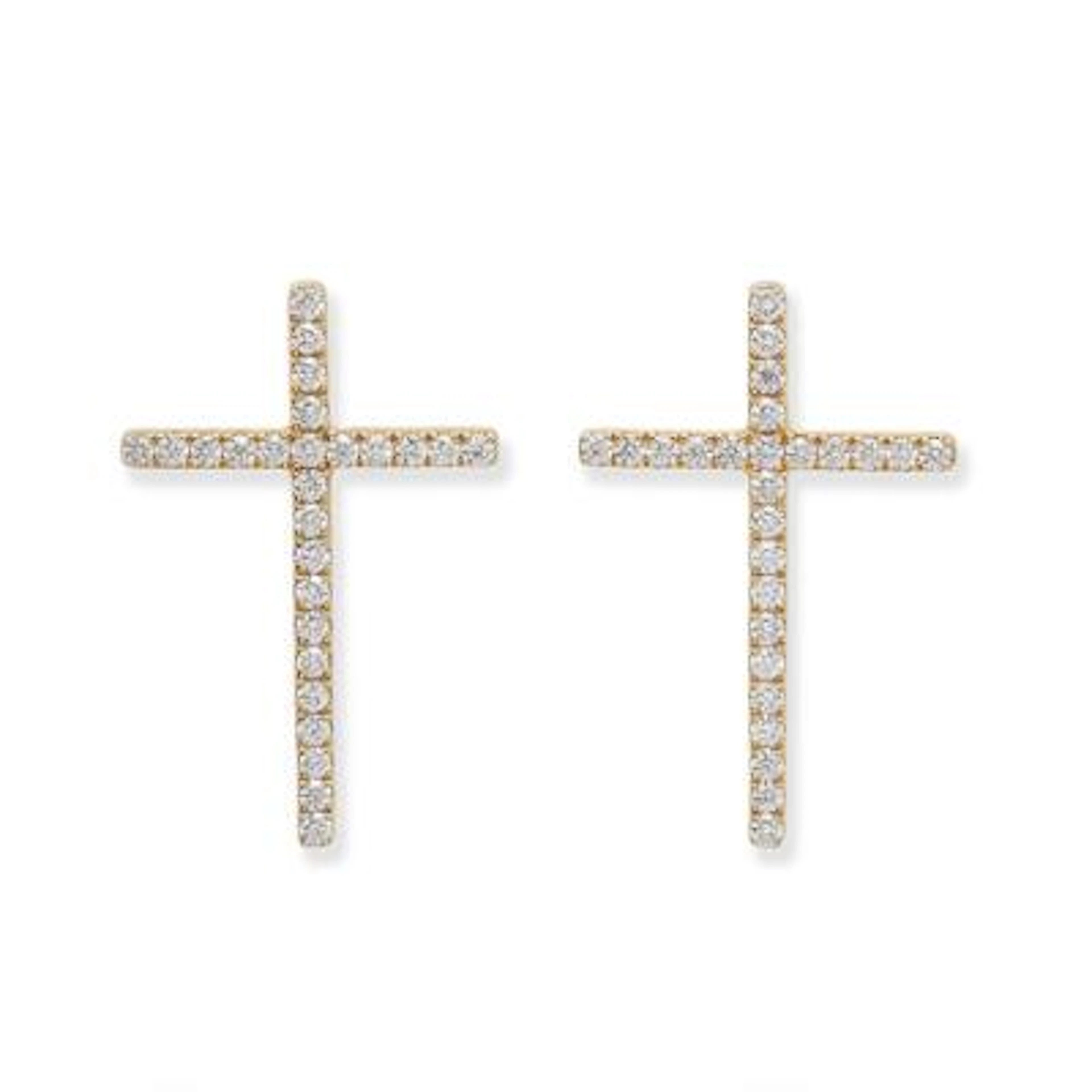 A pair of diamond ear studs in the shape of a cross set with diamonds