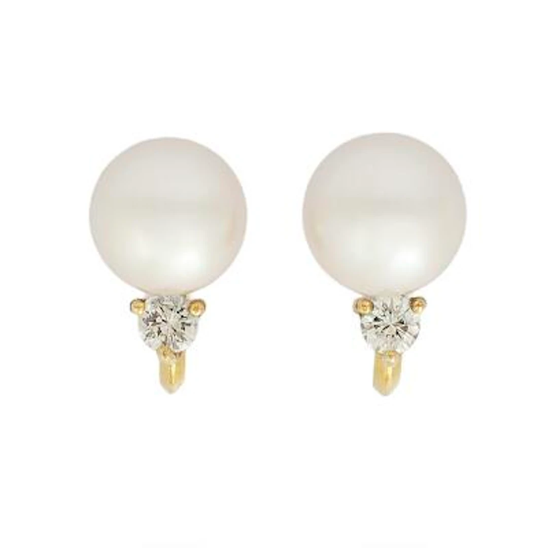 A pair of pearl and diamond ear screws each with a pearl and brilliant-cut