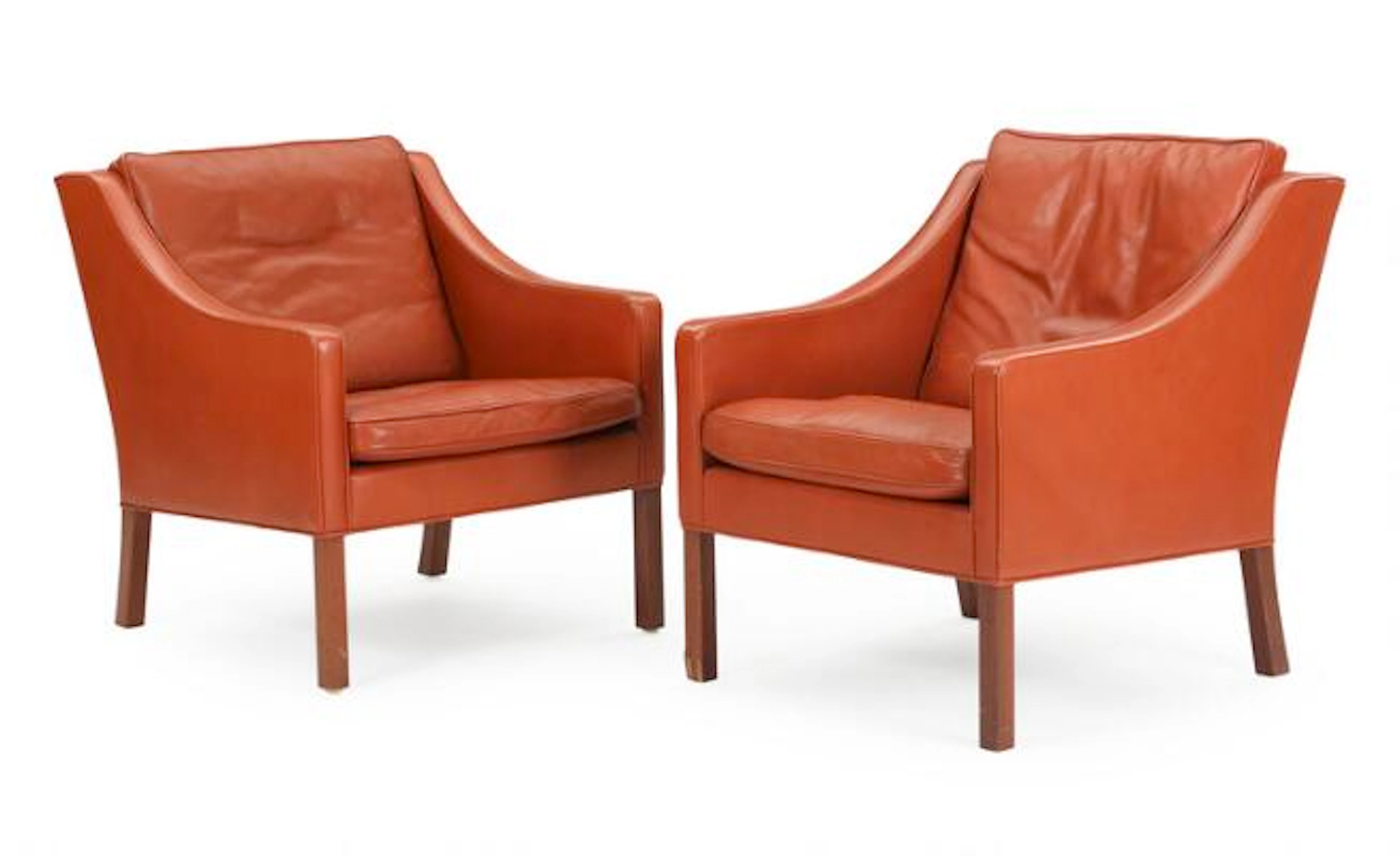 Børge Mogensen: A pair of easy chairs with mahogany legs, upholstered