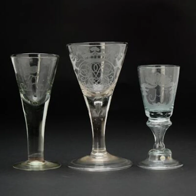 Three German engraved glasses. 18th century. H. 15.5–19 cm. (3) –