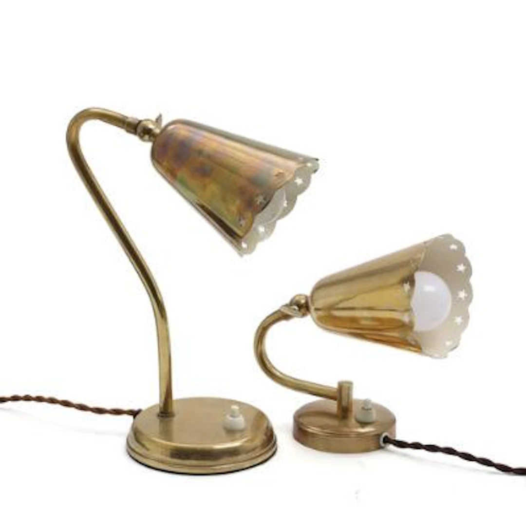 Scandinavian design: A brass wall lamp and a brass table lamp with