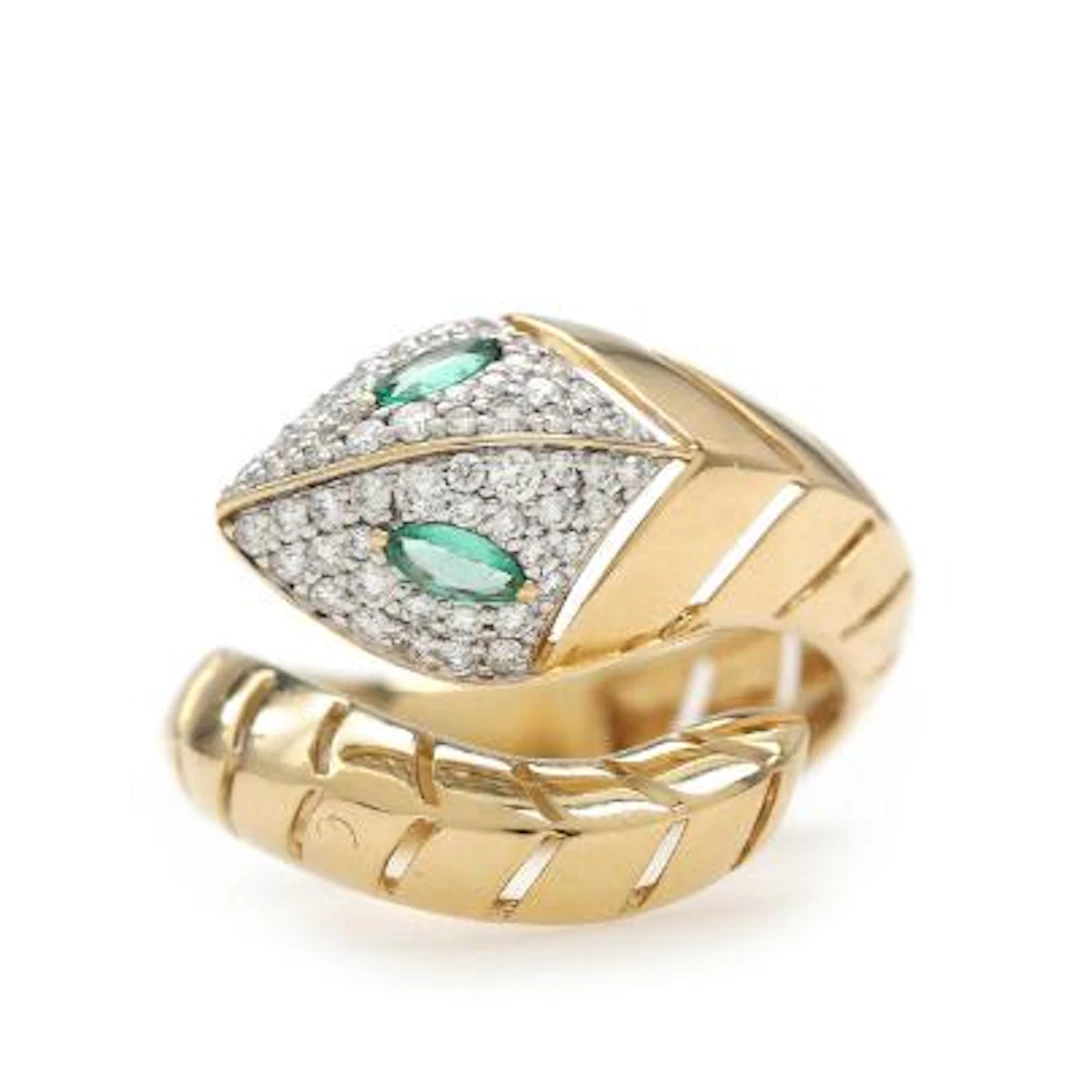 An emerald and diamond ring set with faceted emeralds and brilliant-cut