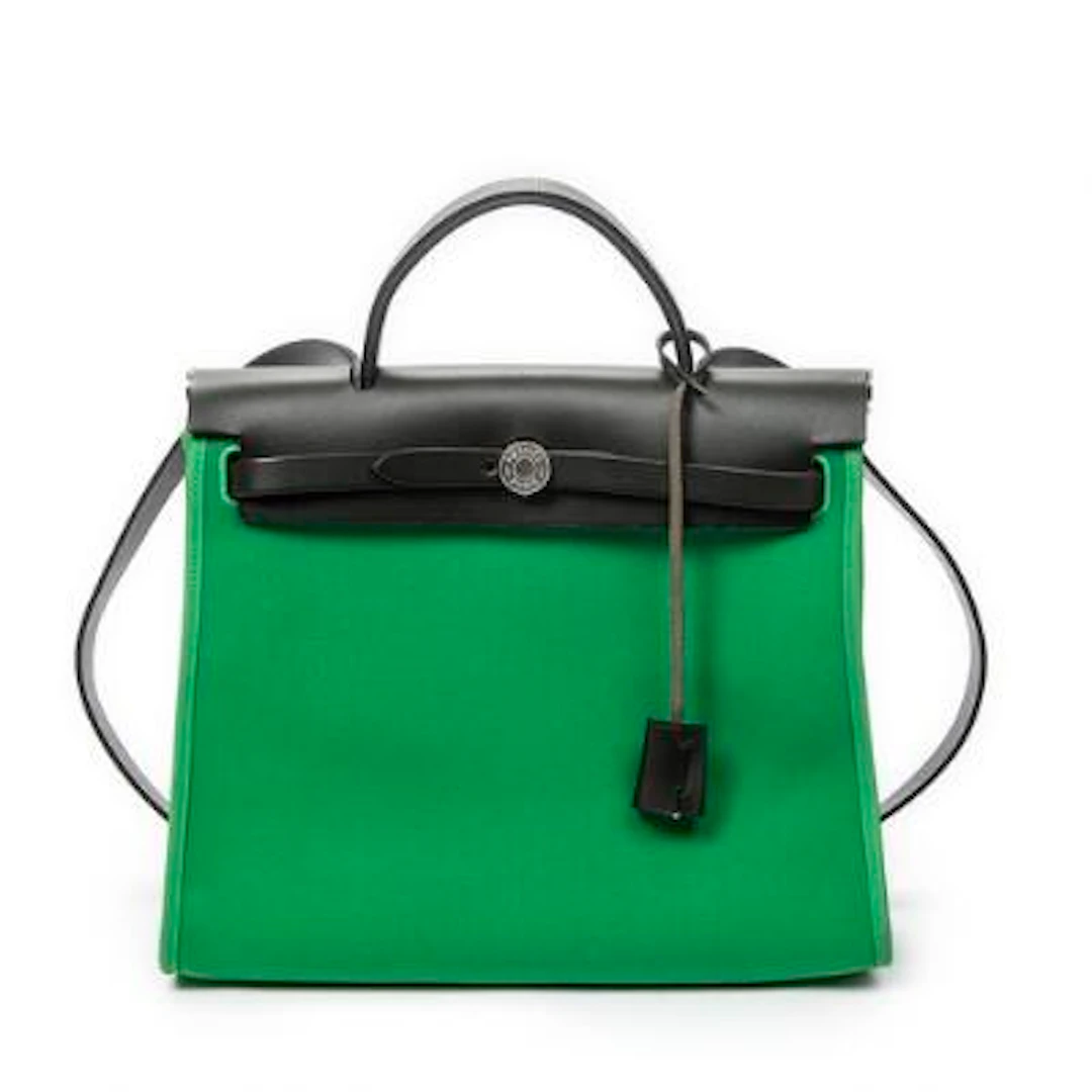 Hermès: A "Herbag Zip PM" bag in green Toile Officier canvas with