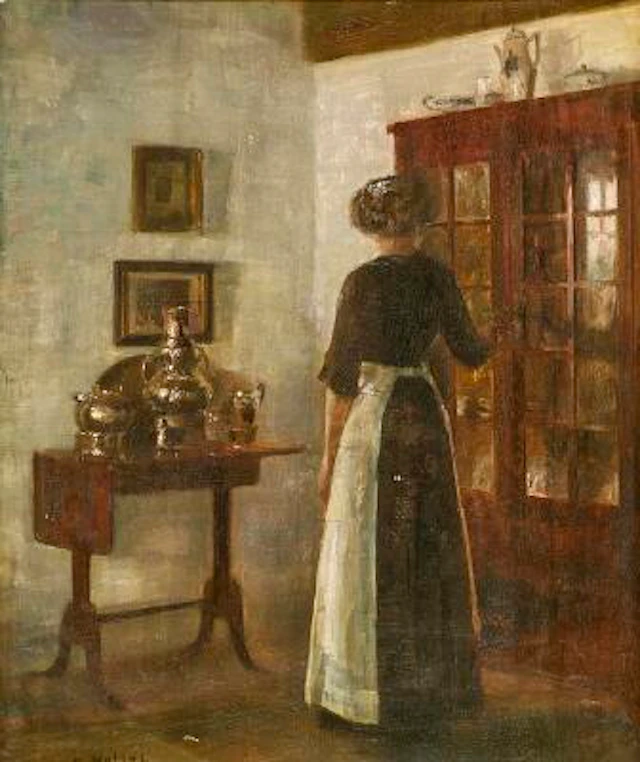 Carl Holsøe: Interior with a woman seen from behind. Signed C. Holsøe.