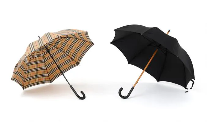 Burberry, Prada: Two umbrellas respectively in beige checkered print