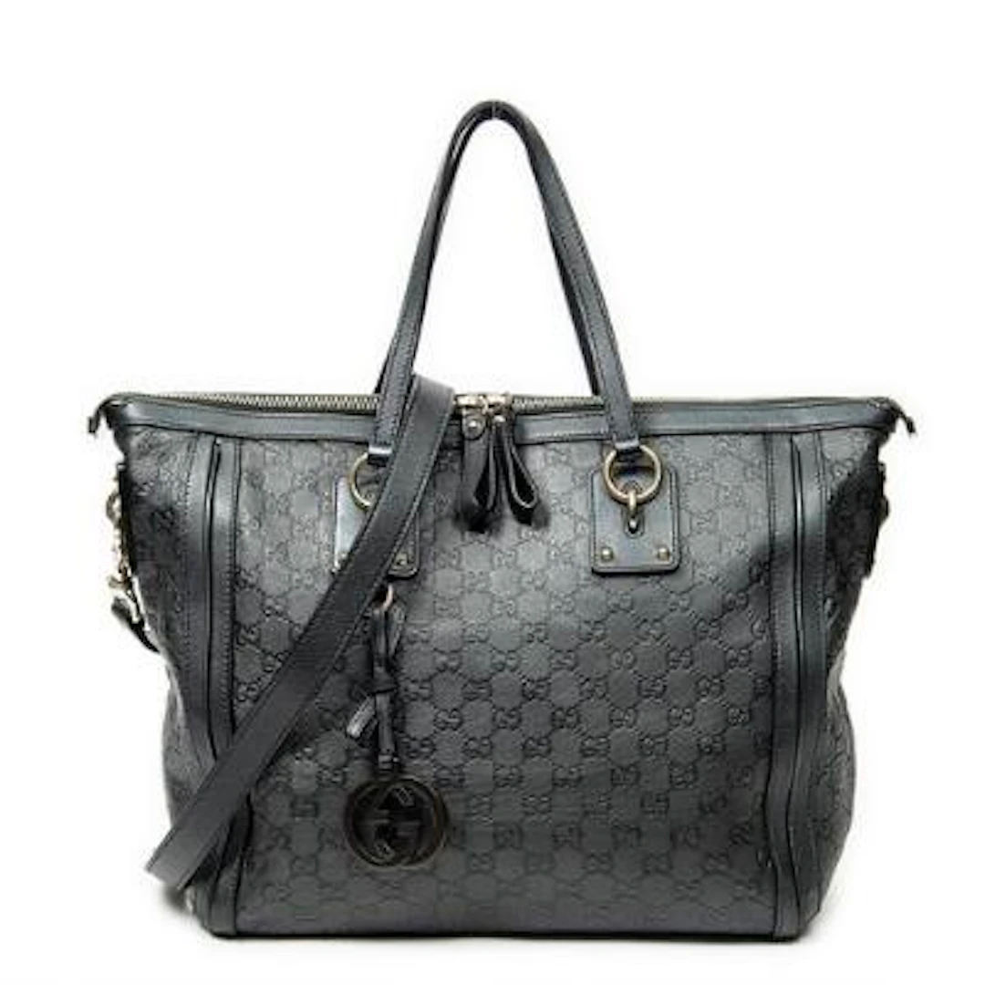 Gucci: A "Large Charm Tote" in dark green Guccissima-monogram leather