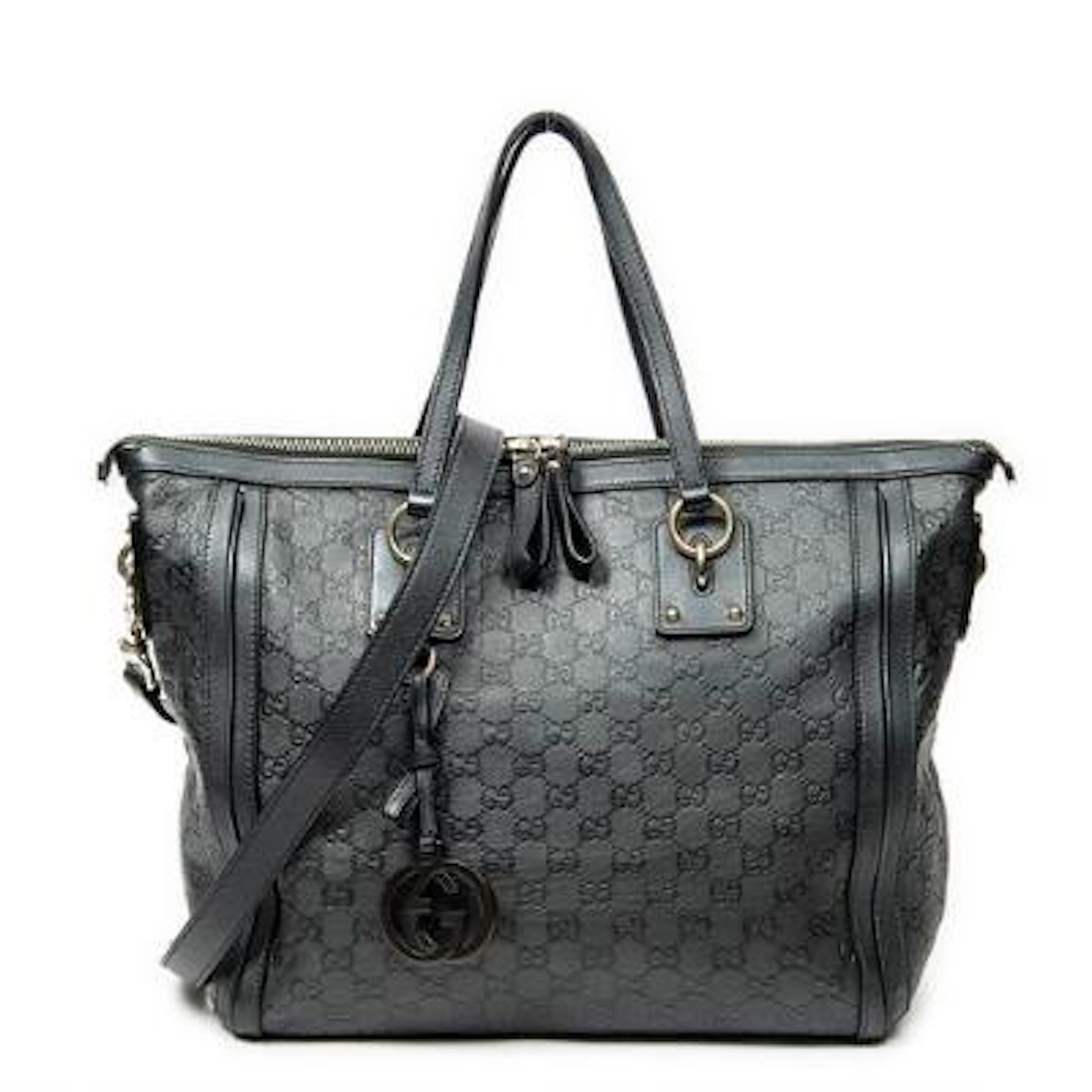 Gucci: A "Large Charm Tote" in dark green Guccissima-monogram leather