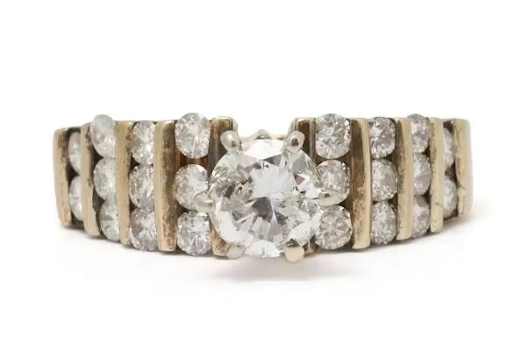 A diamond ring set with numerous brilliant-cut diamonds, mounted in
