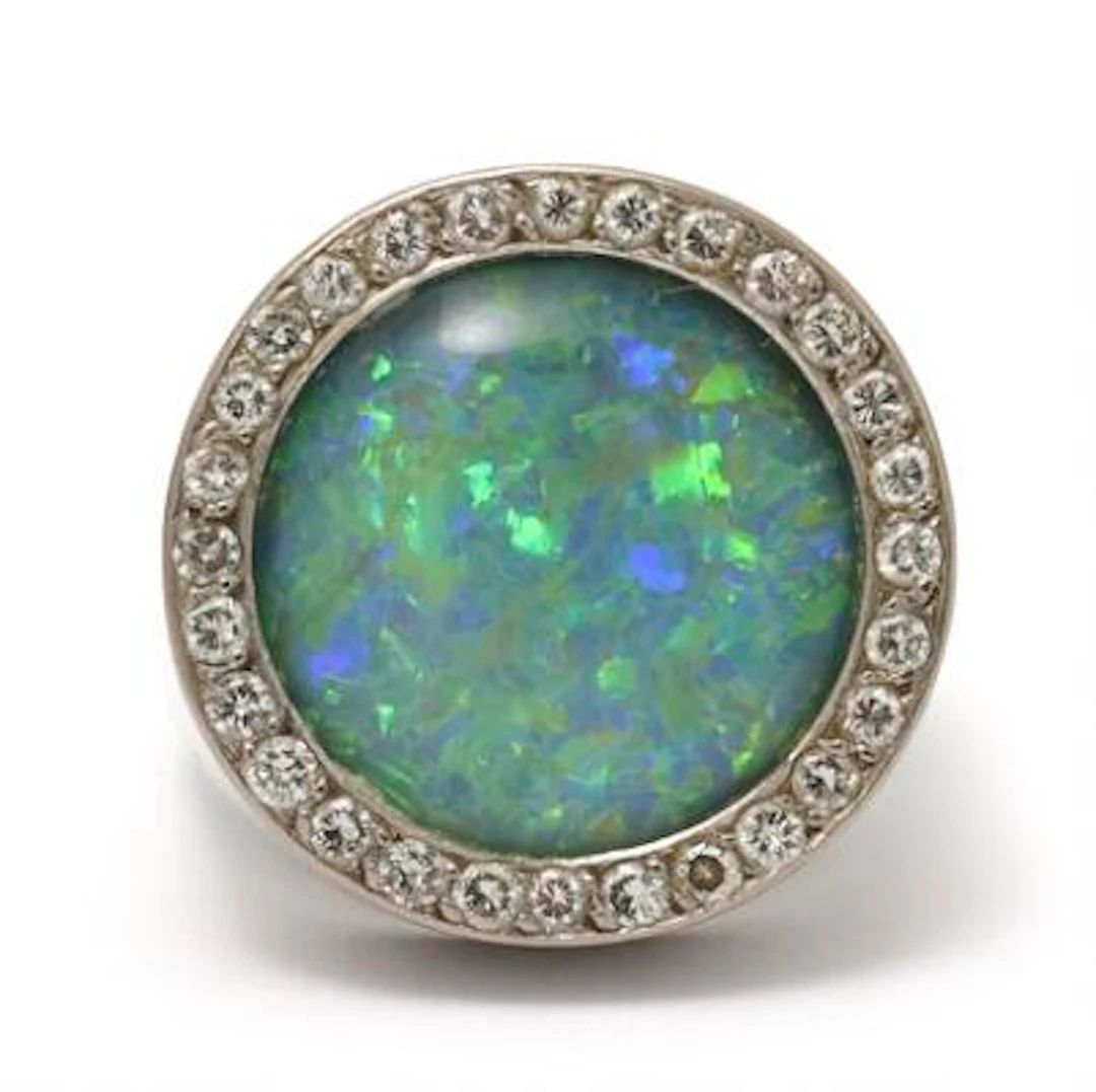 An opal and diamond ring set with an opal triplet and brilliant-cut