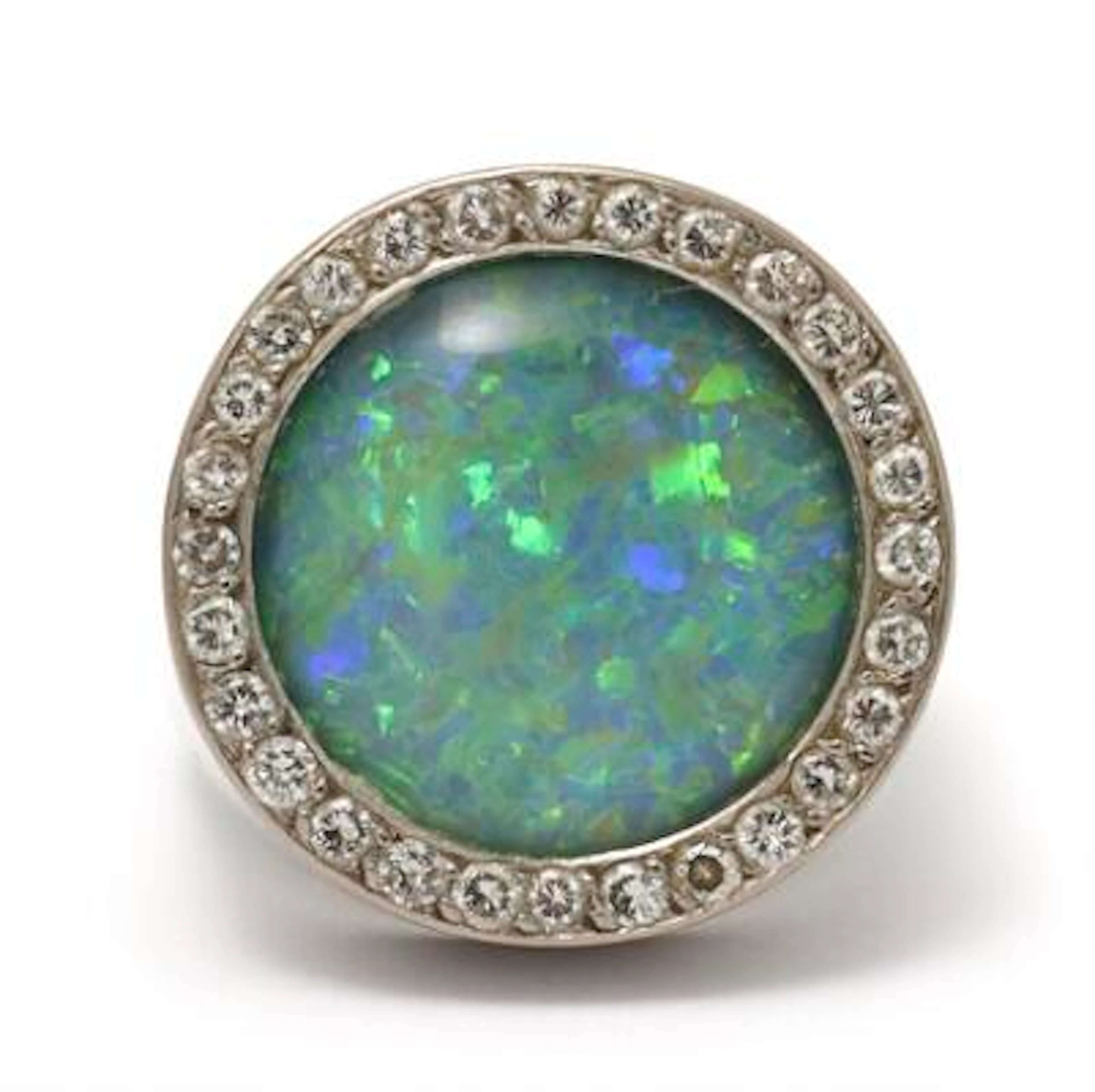 An opal and diamond ring set with an opal triplet and brilliant-cut