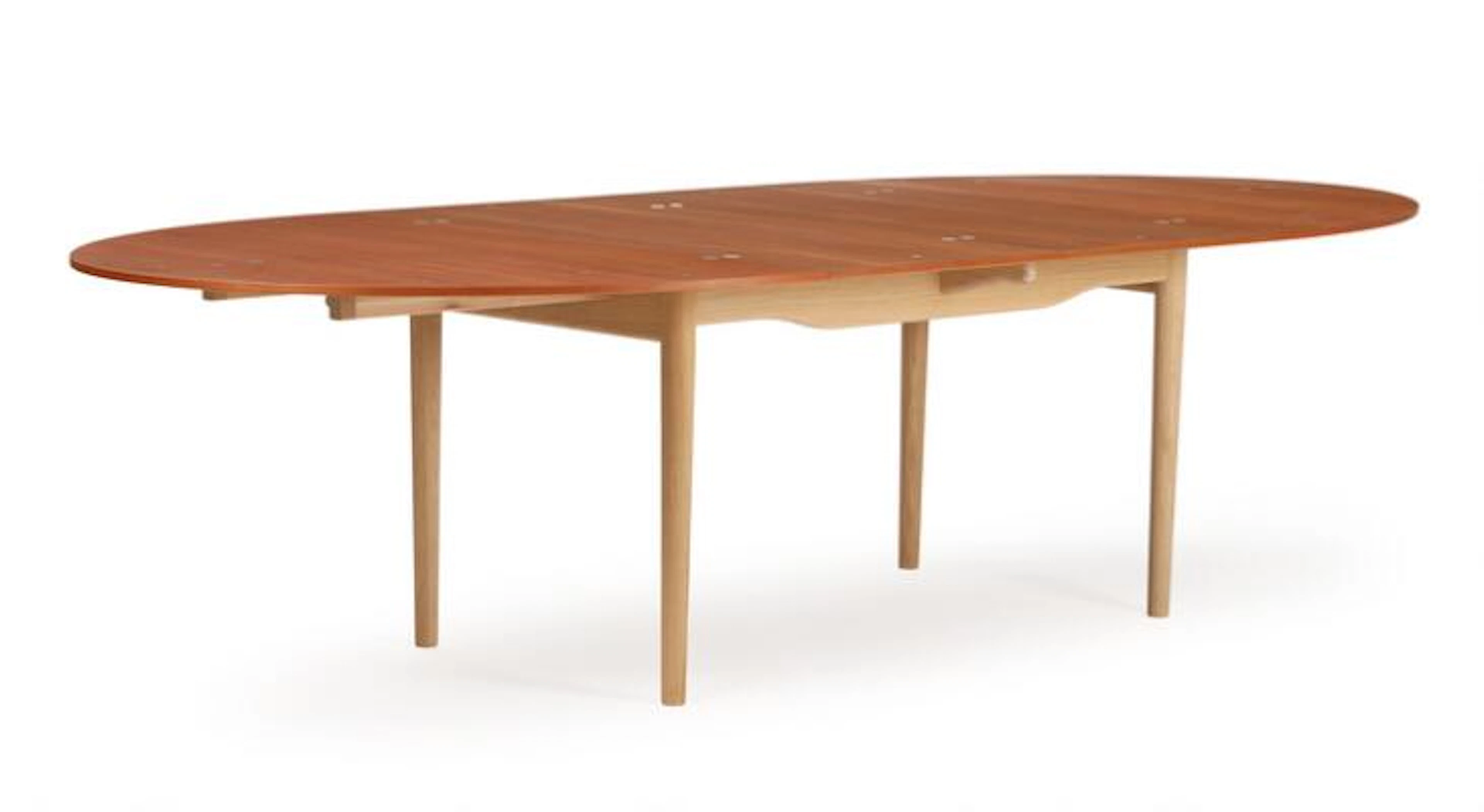 Finn Juhl: “Judas Table”. Oval teak and oak dining table with extension