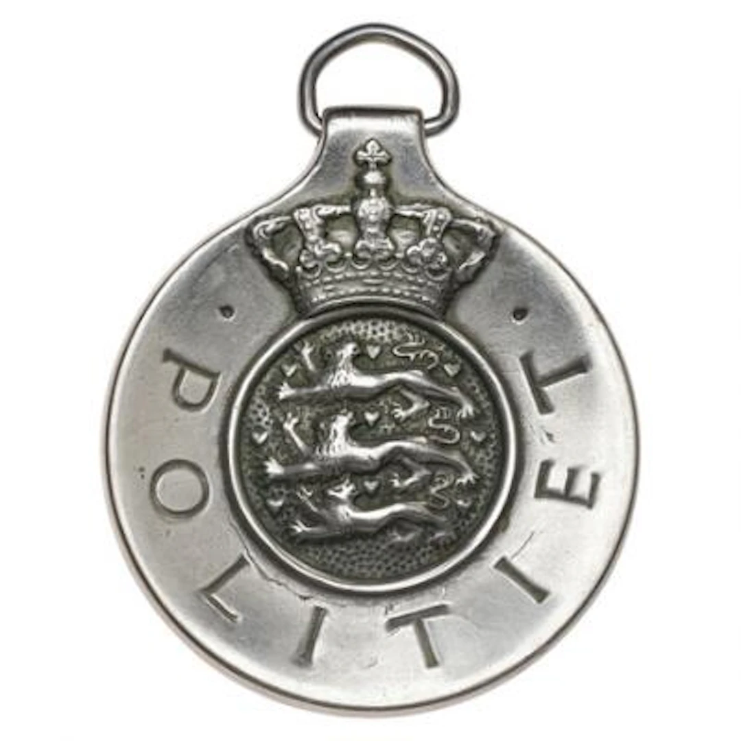 Police badge in bright metal, 1958 edition with the No. 7667, designed
