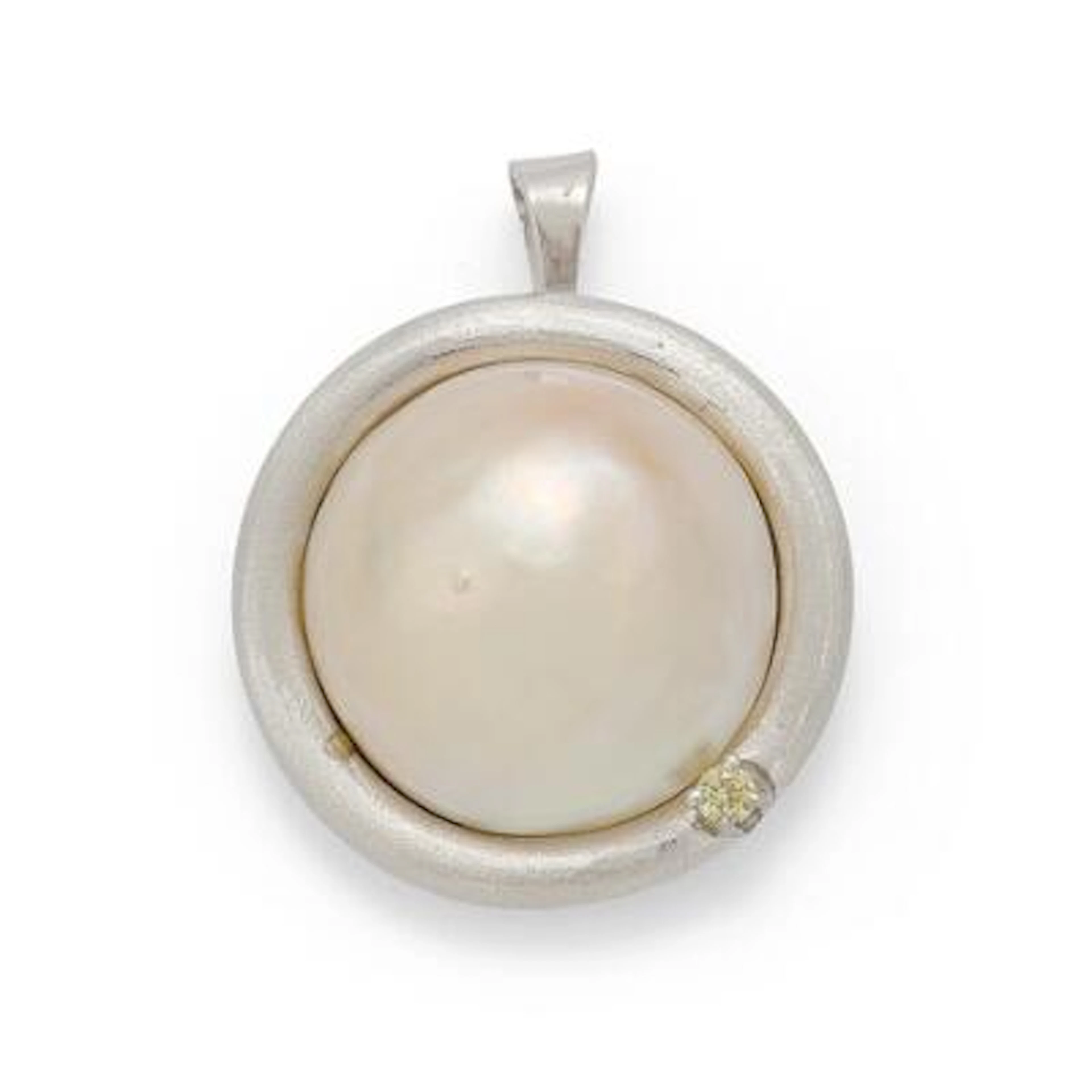A pearl and diamond pendant set with a pearl and diamond, mounted