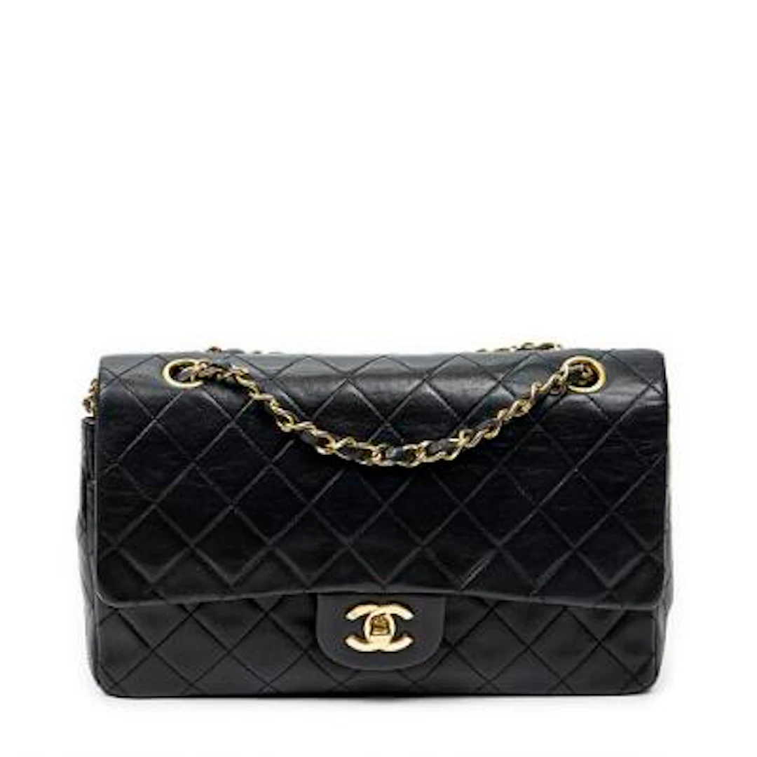 Chanel: A "Classic Double Flap" handbag in black quilted leather with