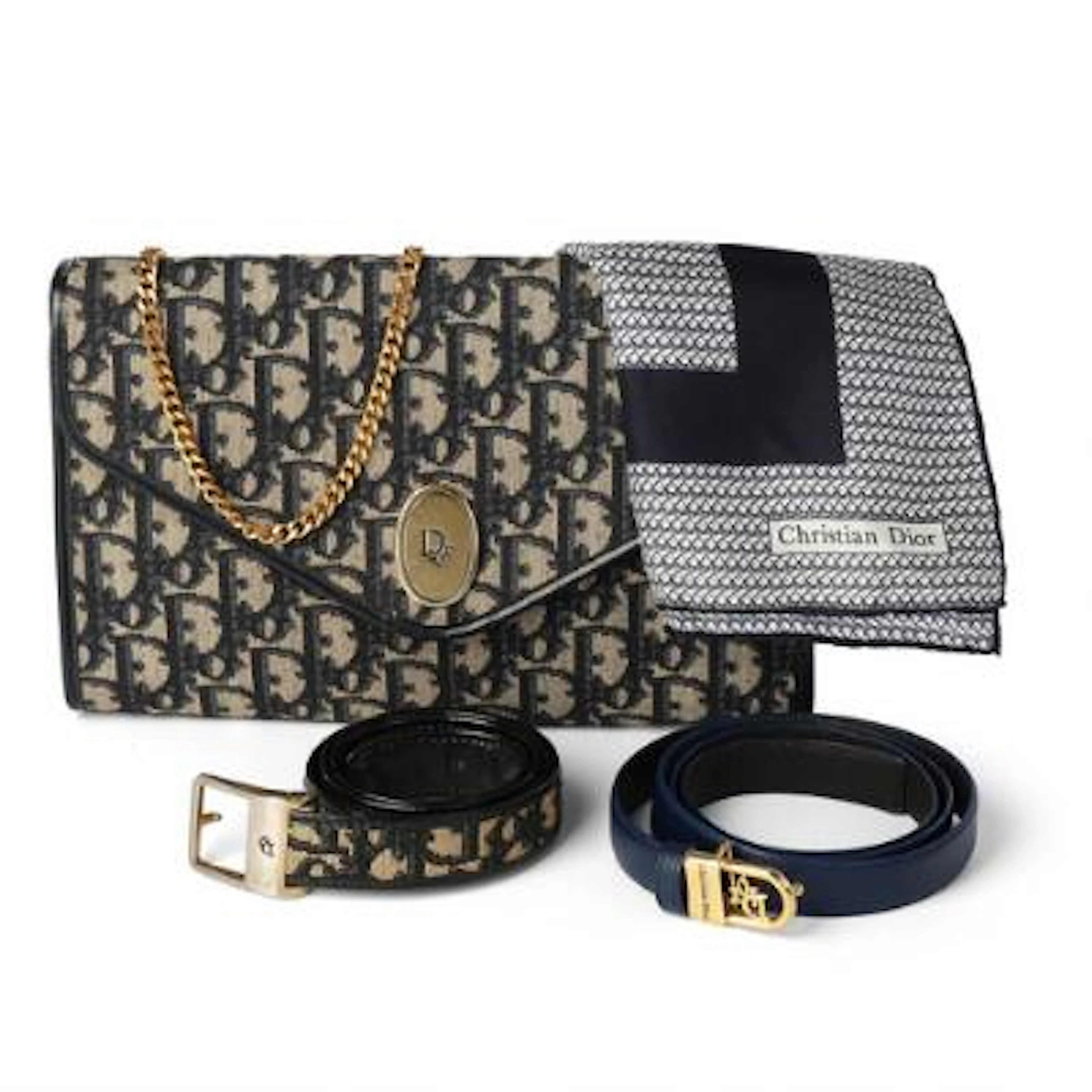 Dior: A collection comprising of a clutch, two belts and a silk scarf.