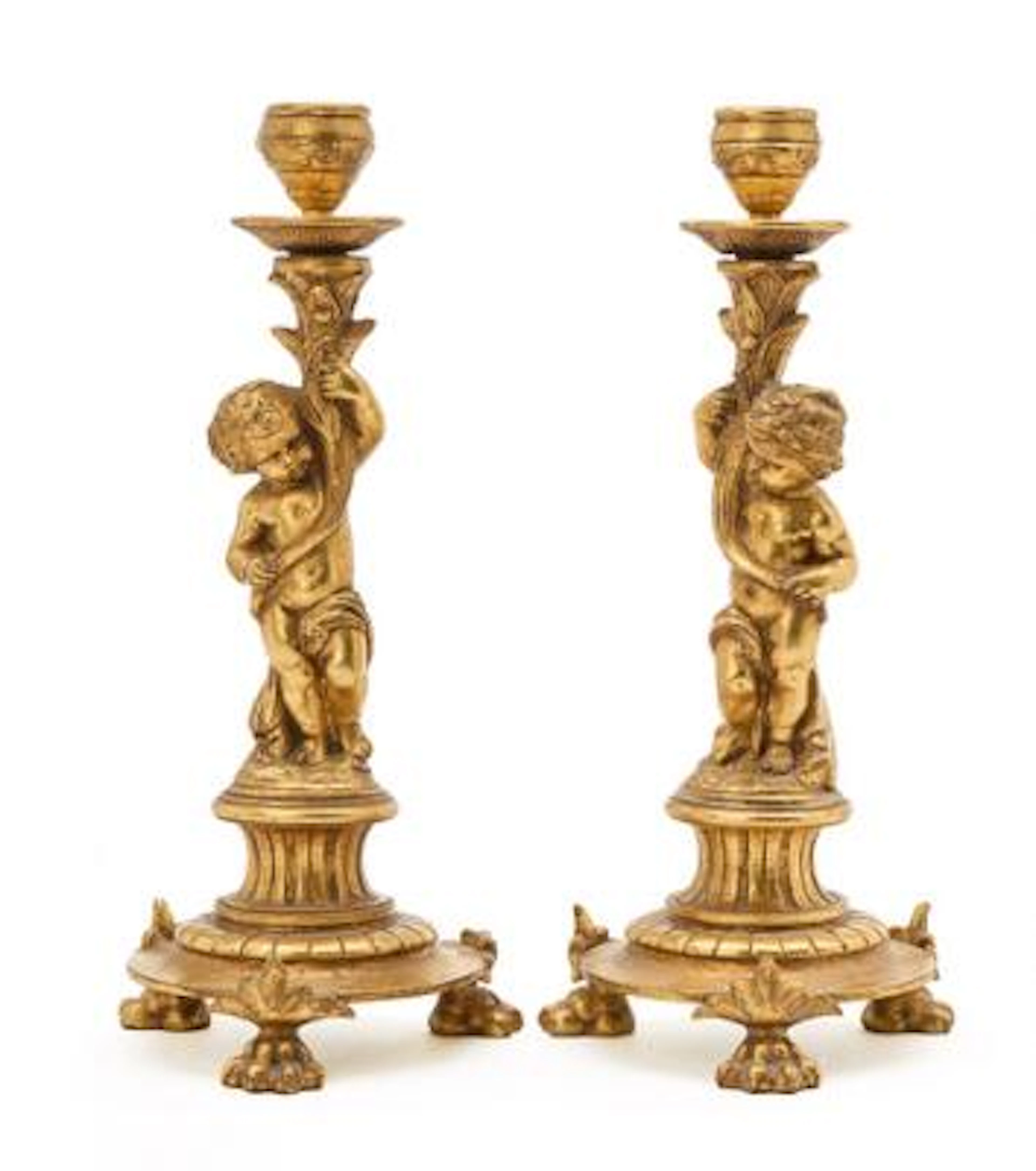 A pair of French late 19th century Belle Epoque gilt bronze candlesticks.