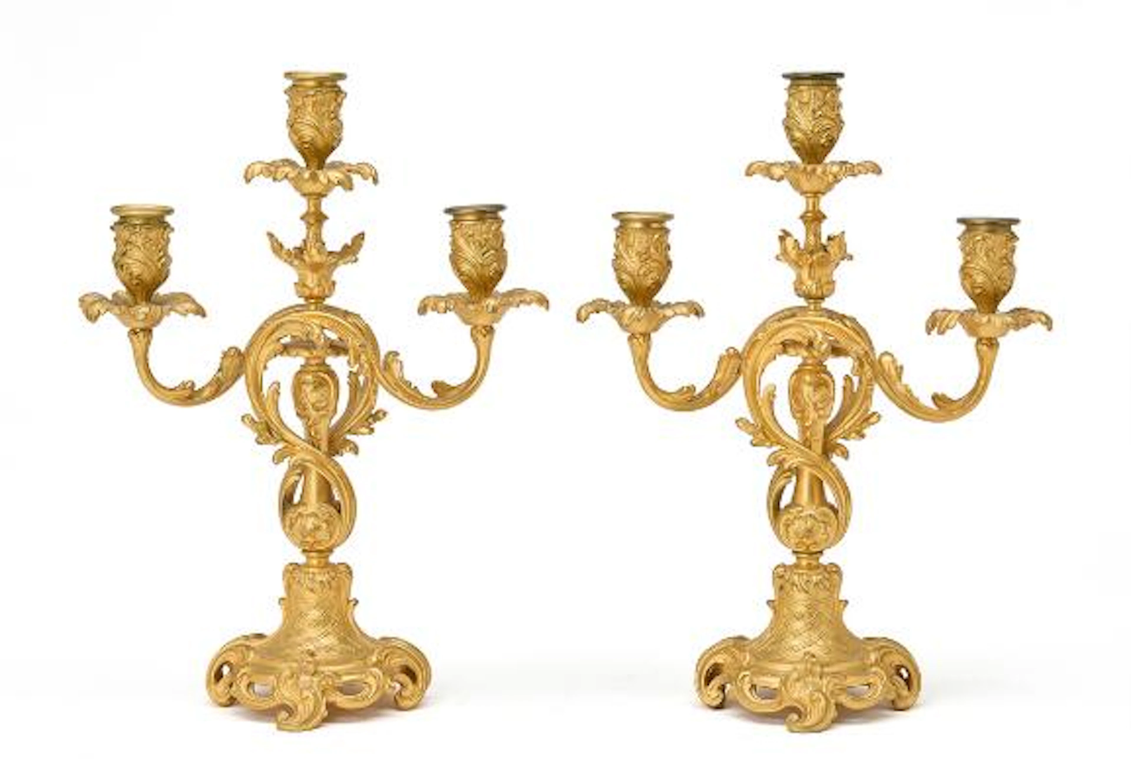 A pair of French Rococo revival gilt bronze candelabra, marked F.