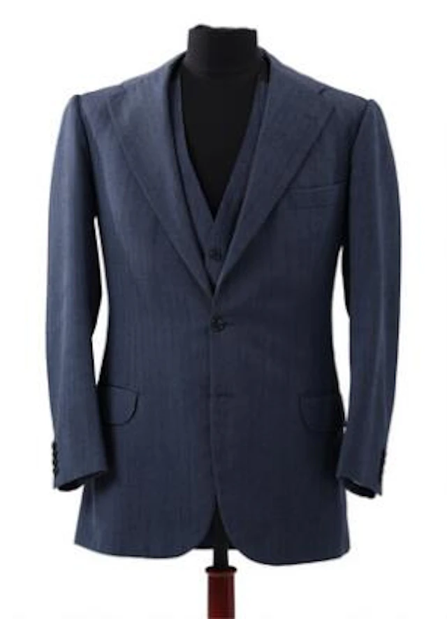 Alfred Alm: A three-piece business suit in mid-blue herringbone. 1984.