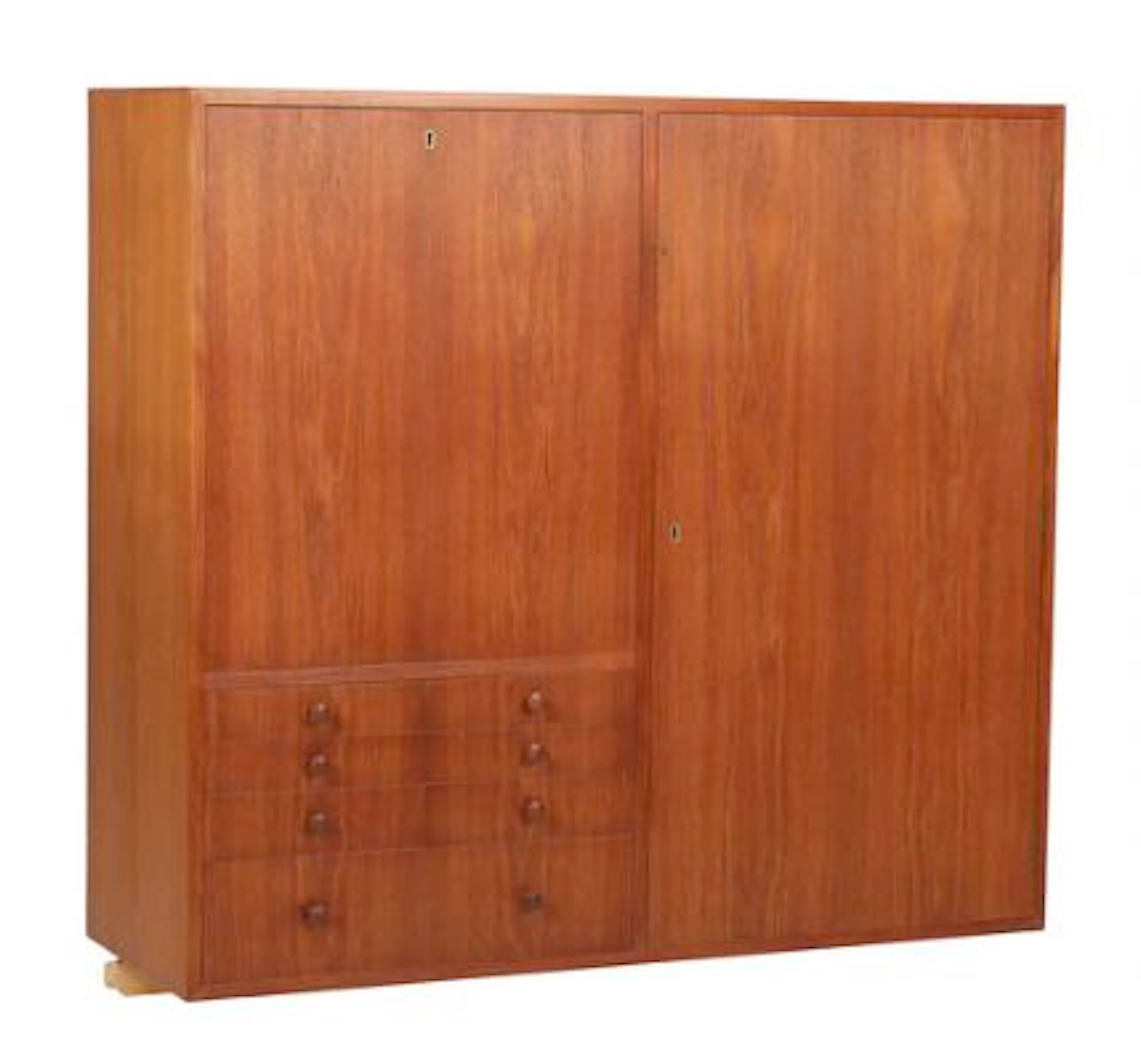 Finn Juhl: A teak cabinet with maple frame and teak shoes. Front with