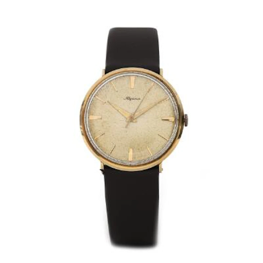 Alpina: Wristwatch of 14k gold. Mechanical movement with manual winding.