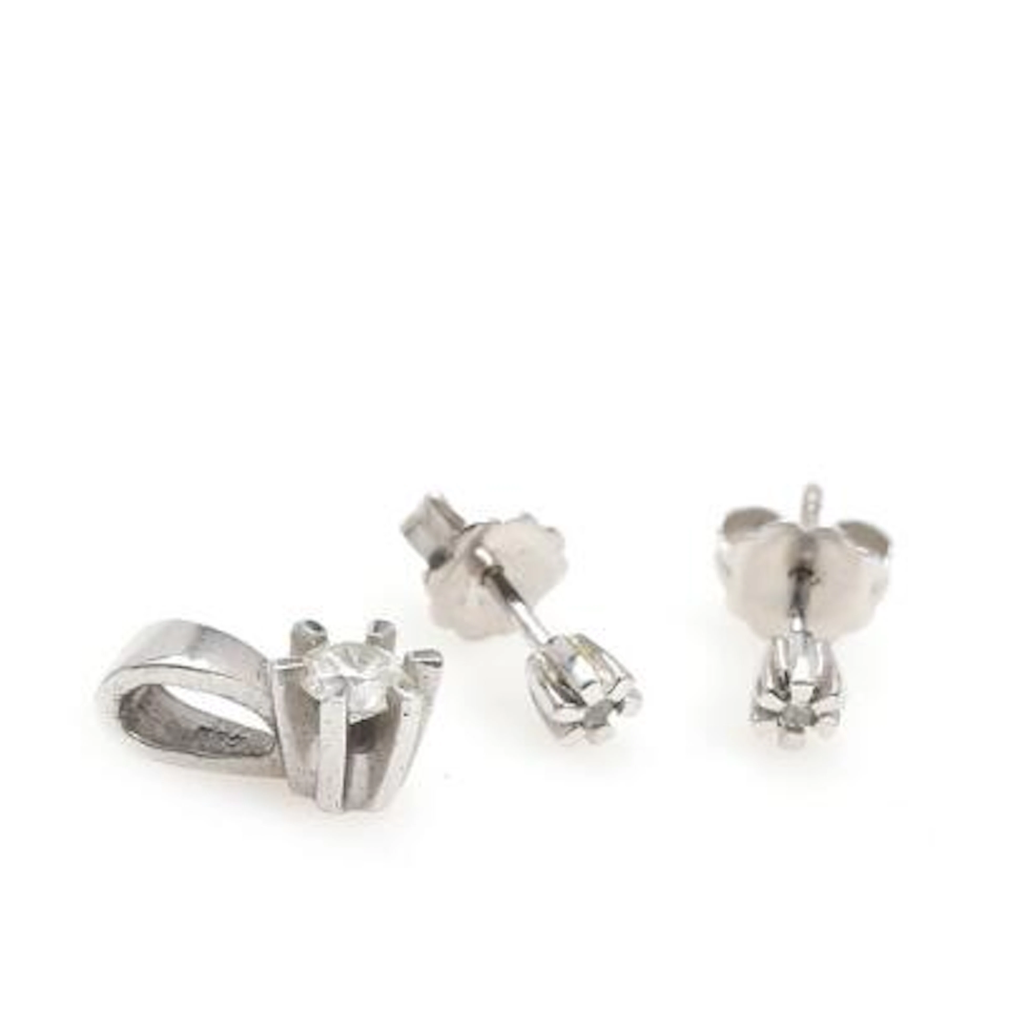 A diamond pendant and earrings each set with diamond, mounted in 14k