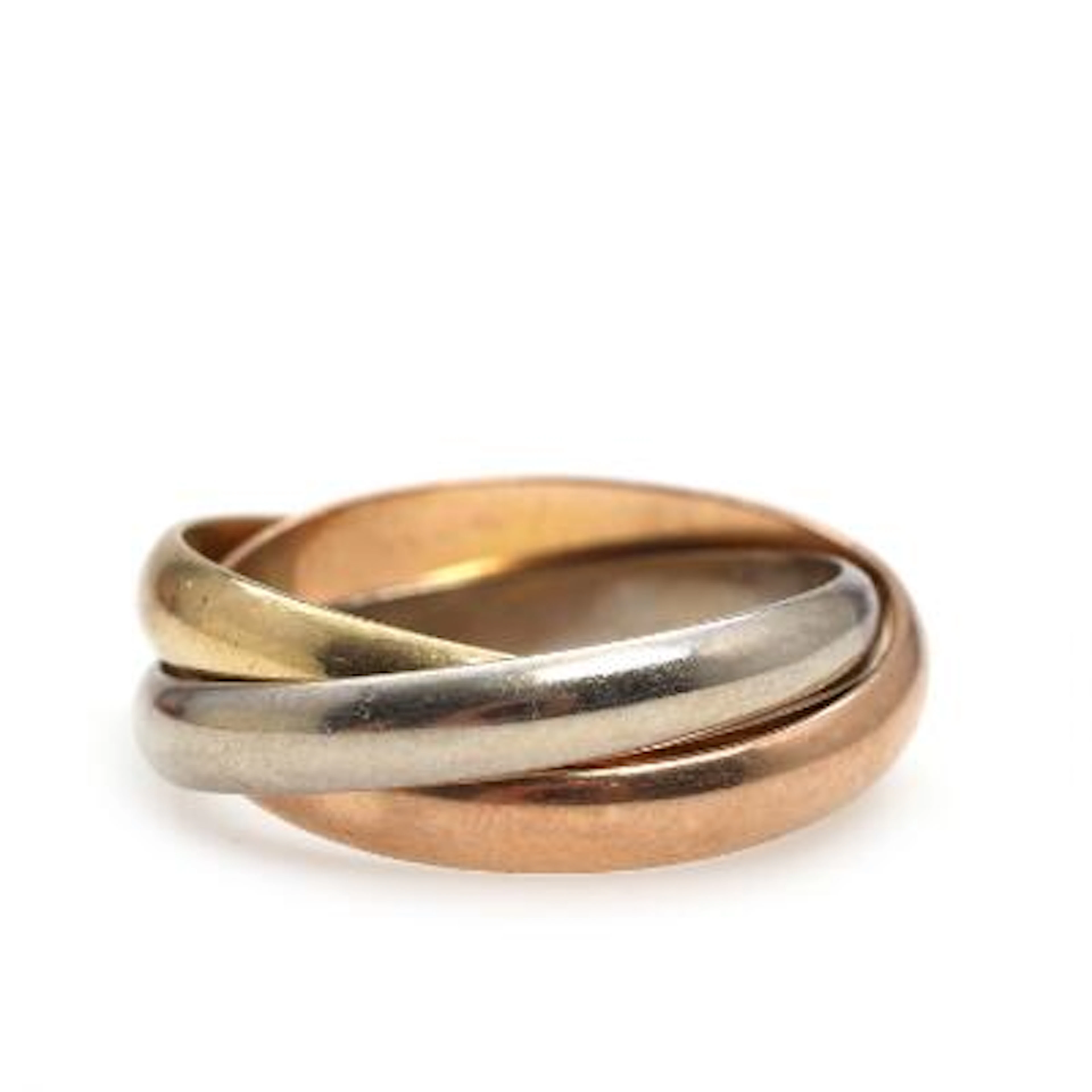Must de Cartier: An 18k gold, red and white gold "Trinity" ring. Weight