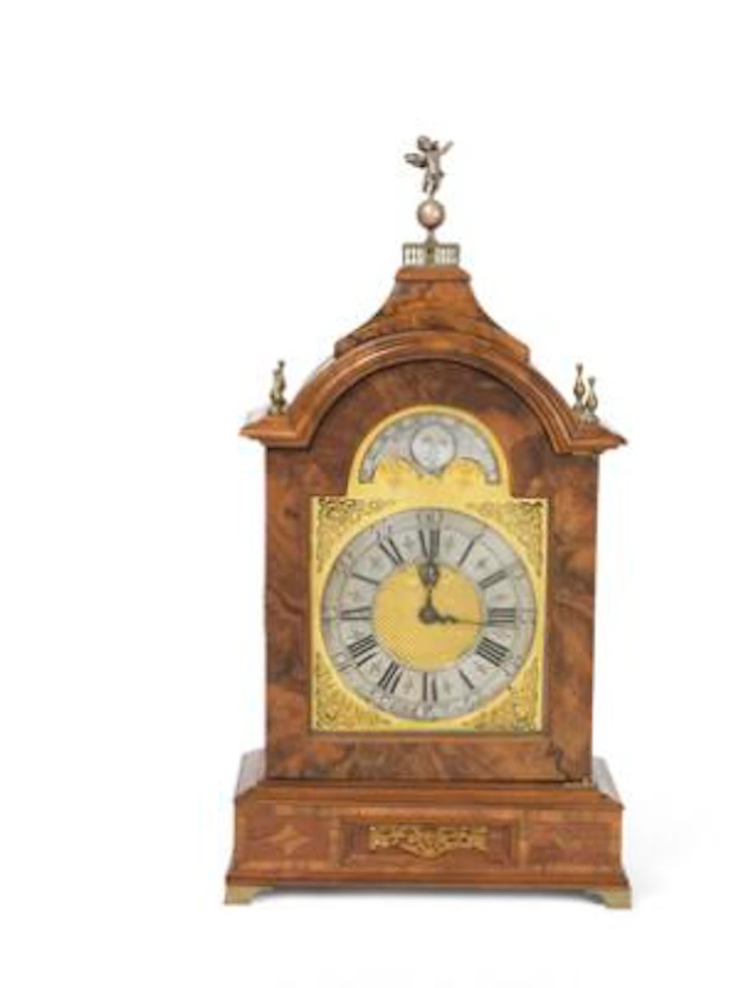 A George II musical clock in a walnut case. The dial and movement