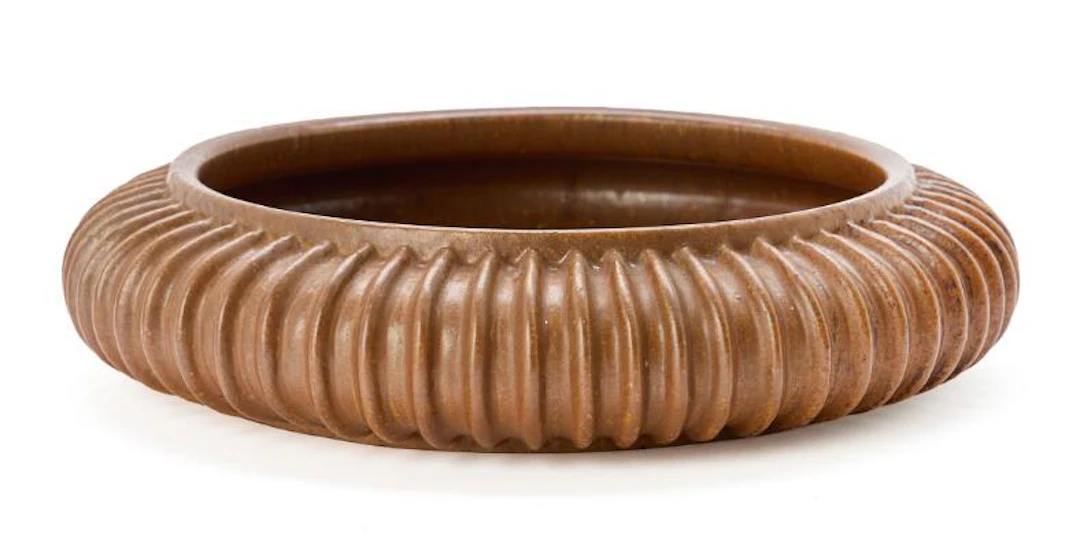 Arne Bang: A circular stoneware dish, the outer surface modelled with
