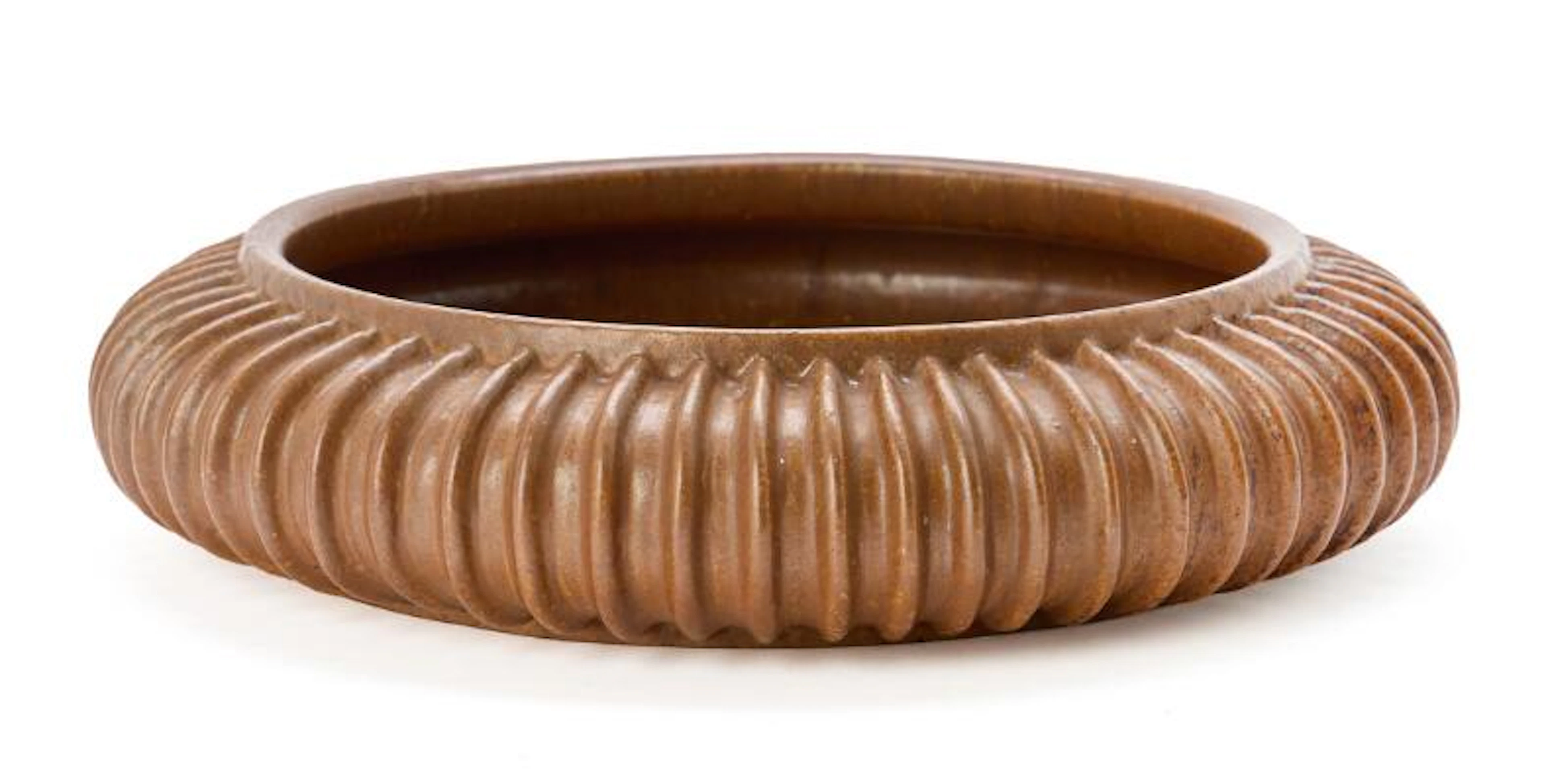Arne Bang: A circular stoneware dish, the outer surface modelled with