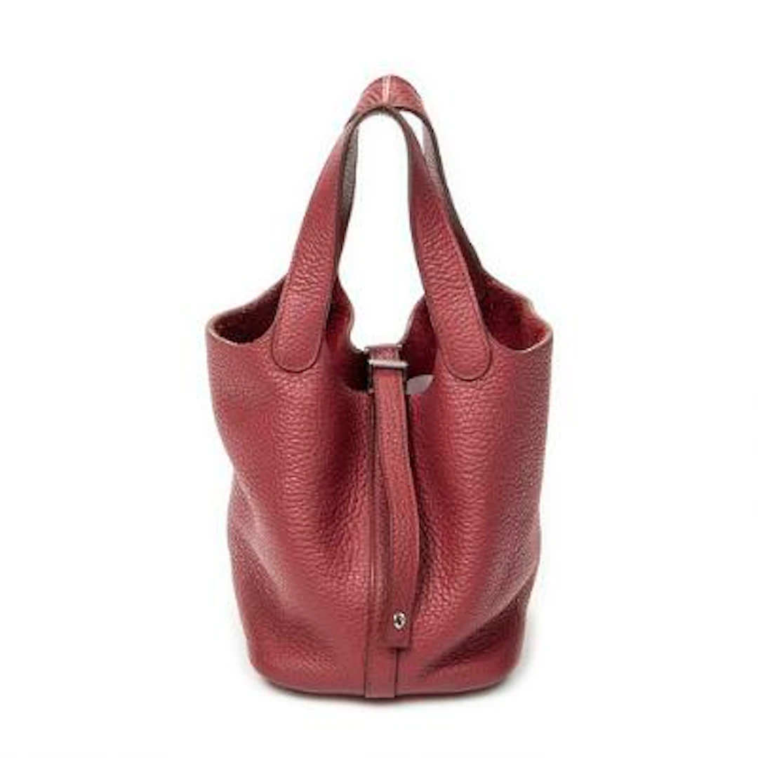 Hermès: A "Picotin 18" bag in reddish pink Clemence-leather with palladium