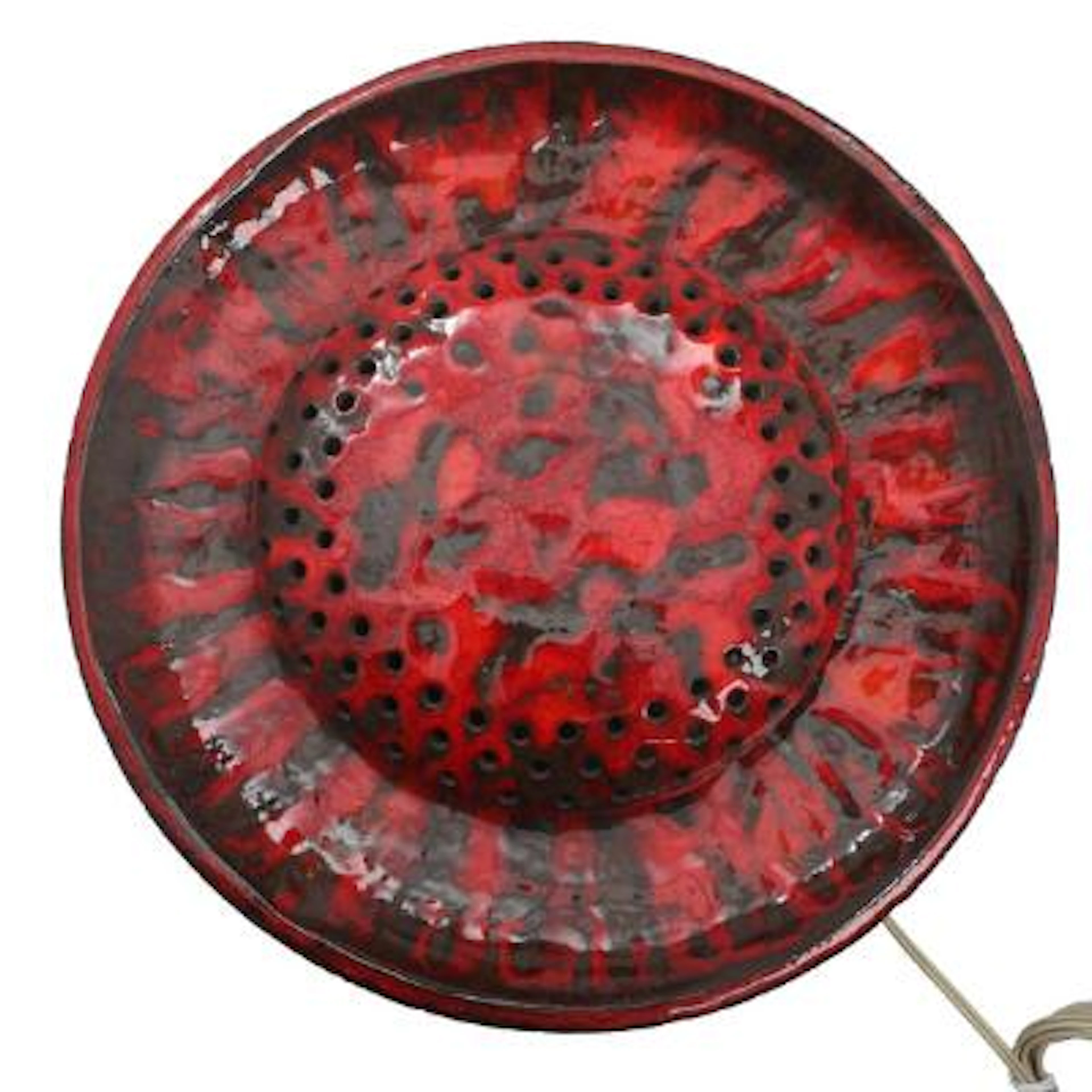 Danish design: A circular earthenware wall lamp, decorated with red