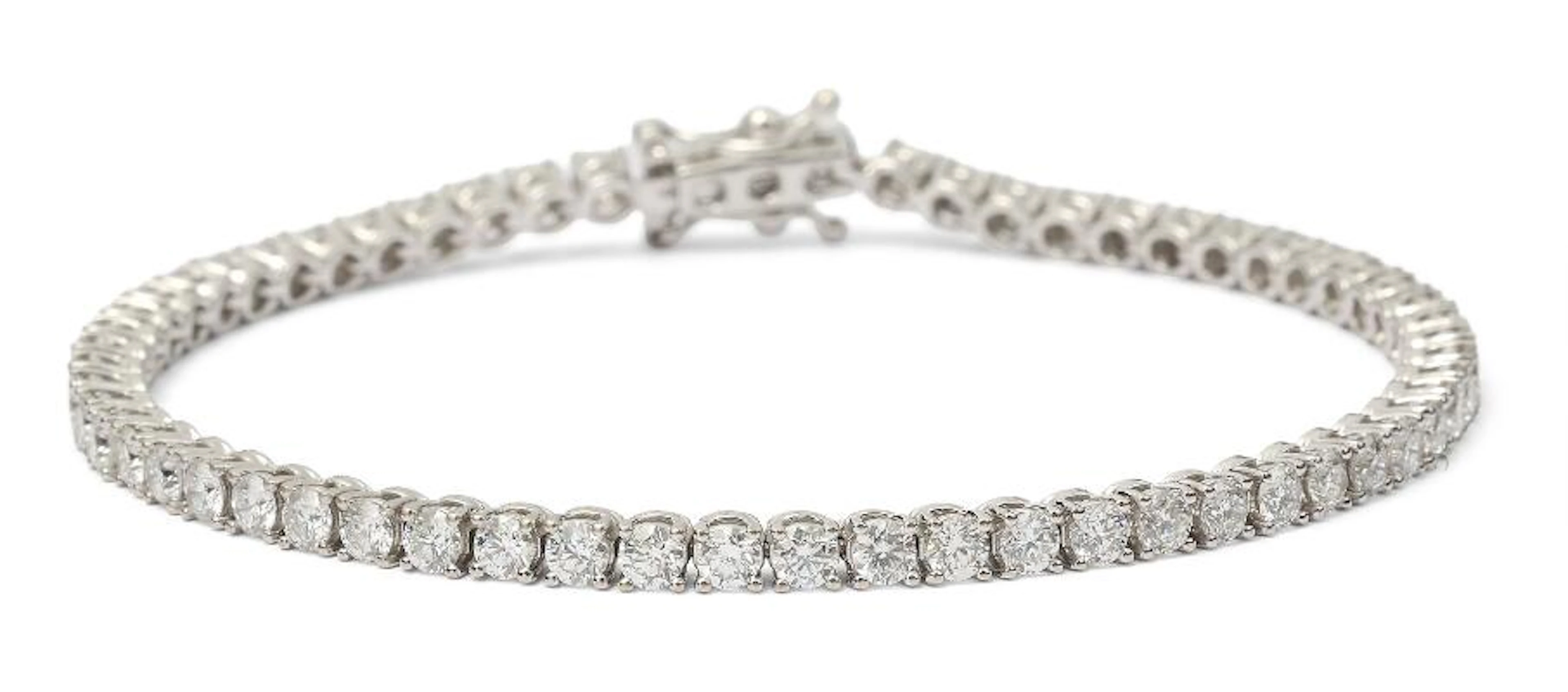A diamond tennis bracelet set with numerous diamonds weighing in total