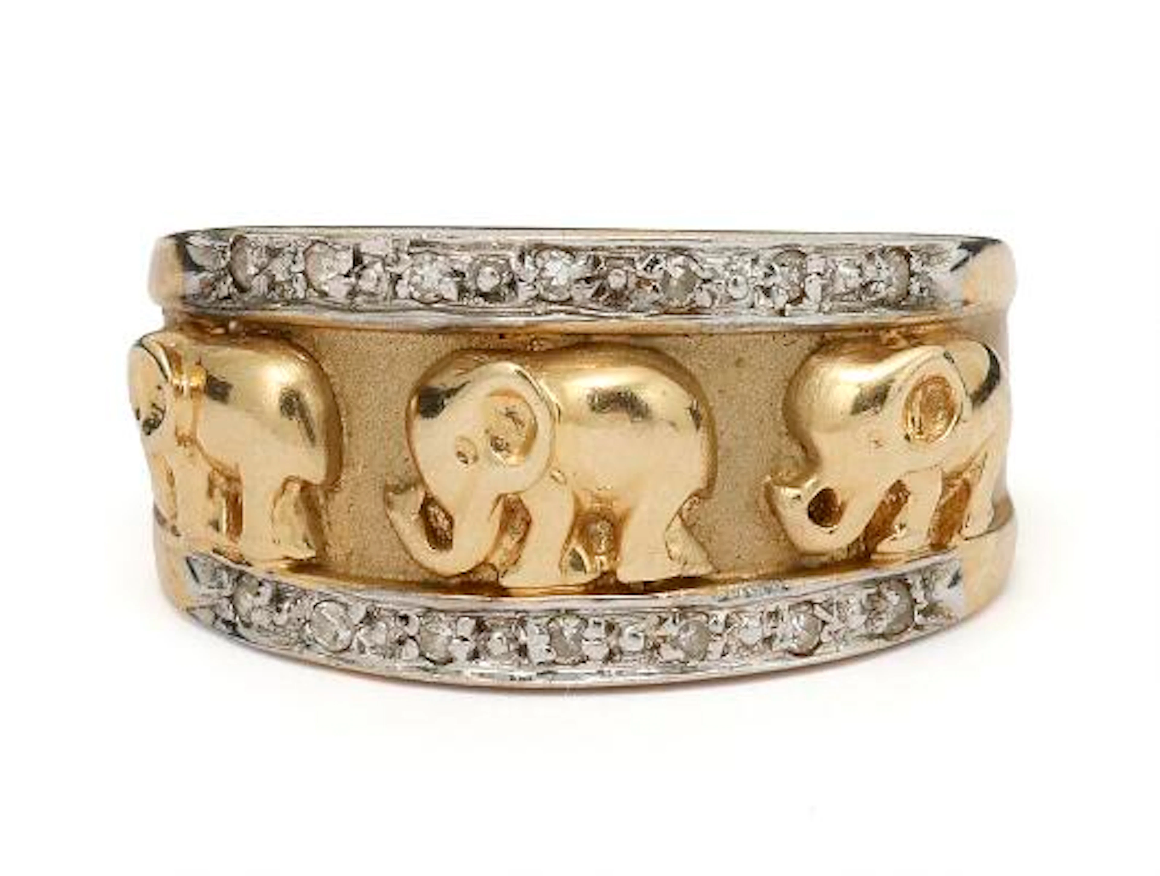 A diamond ring set with diamonds and an elephant motif, mounted in