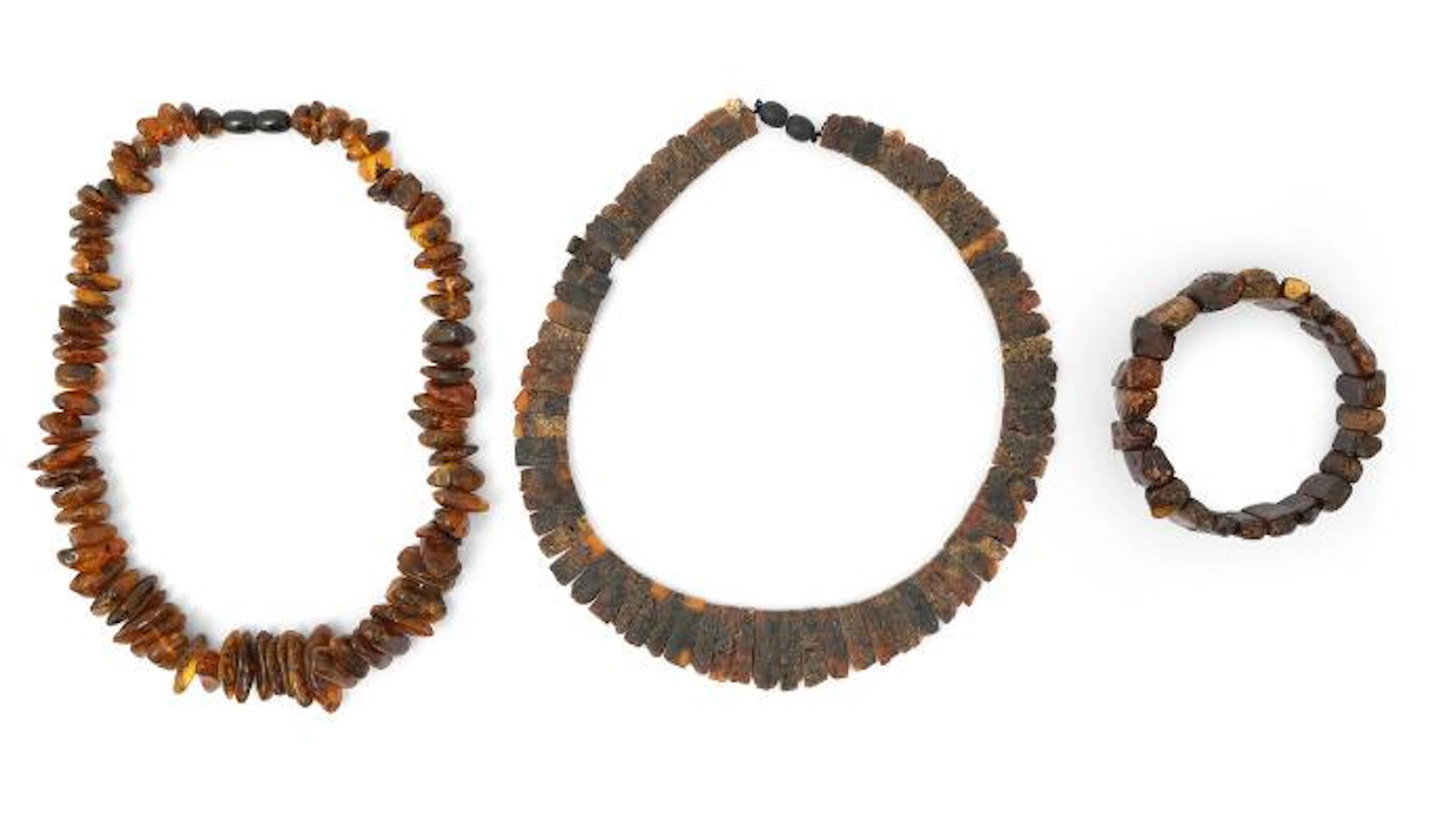 A jewellery colletion comprising of two amber necklaces and a bracelet